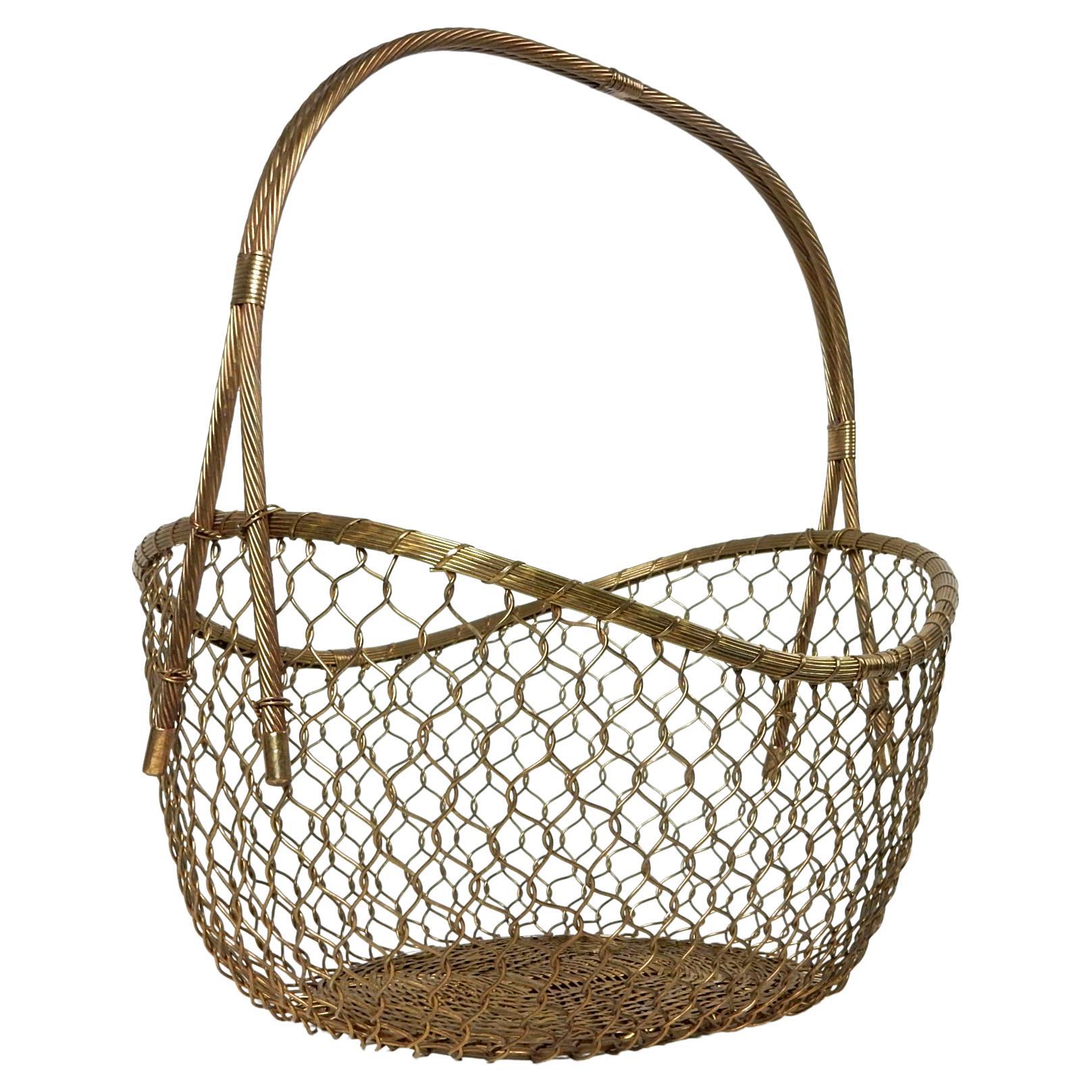 Exceptionally large and exquisitely crafted solid brass woven basket circa 1970.
The detail is amazing at this scale. Holds dozens of your favorite magazines or
a few blankets or?
It is a solid and does not flex like a wicker basket.