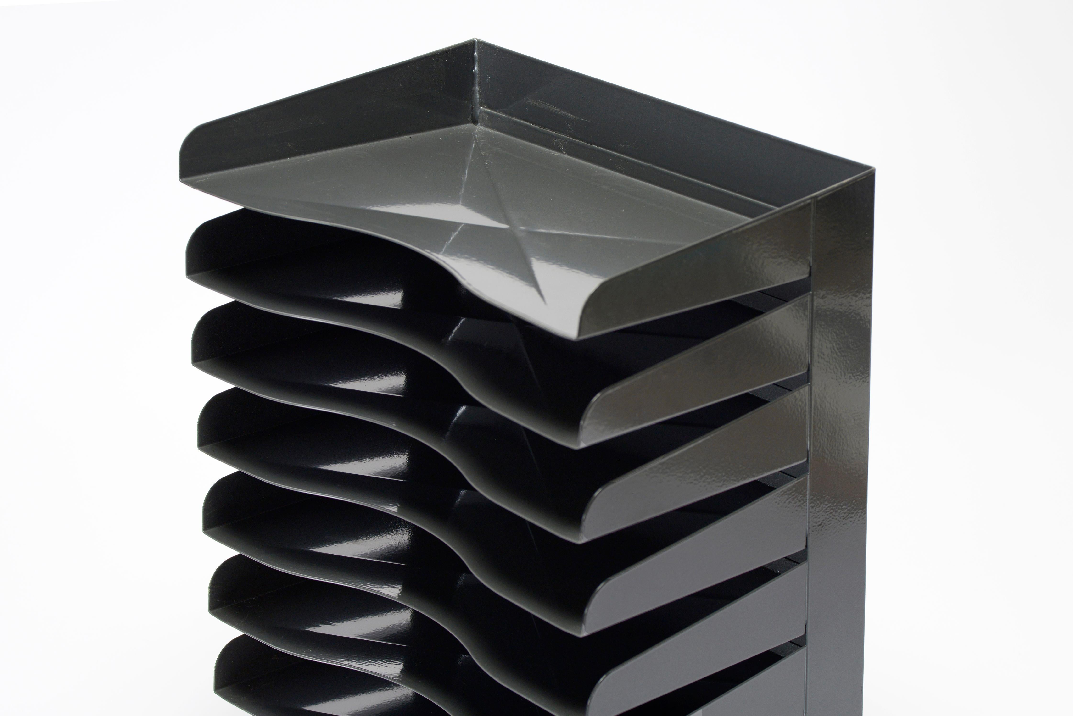 This tower of a desktop file organizer sits at 8 trays tall. Nice articulated retro styling including a waterfall base and X imprint design on each tray. Newly refinished in dark gloss grey. 

This one's in excellent refinished vintage condition.