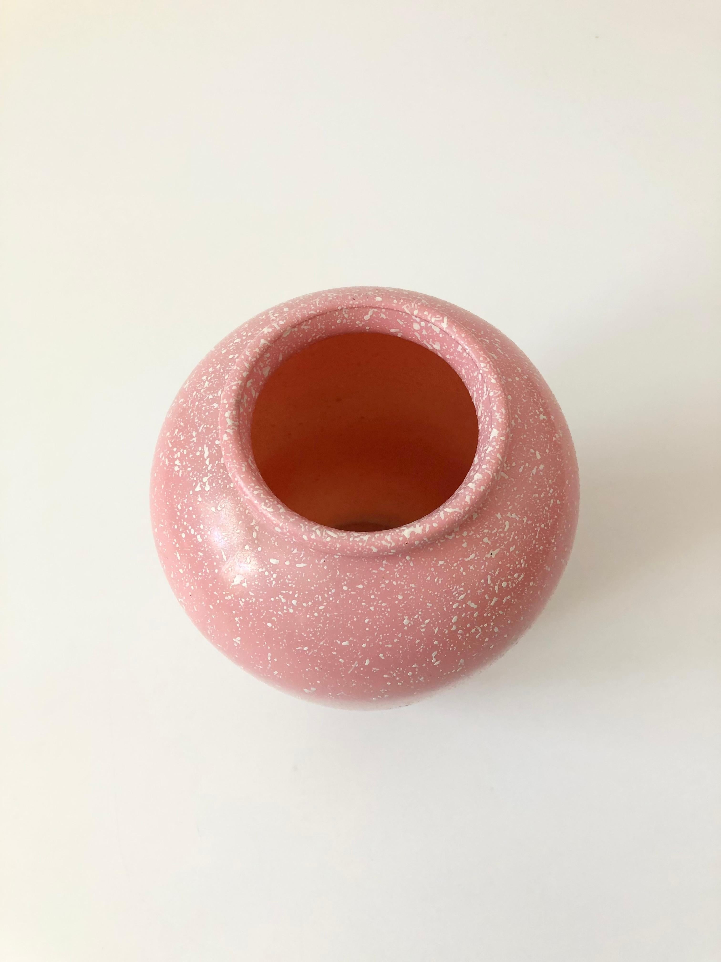 A tall vintage glass vase with a lovely speckled pale pink color to the glass. Nice size in a circular tapered shape. Made in Portugal by Studio Nova.