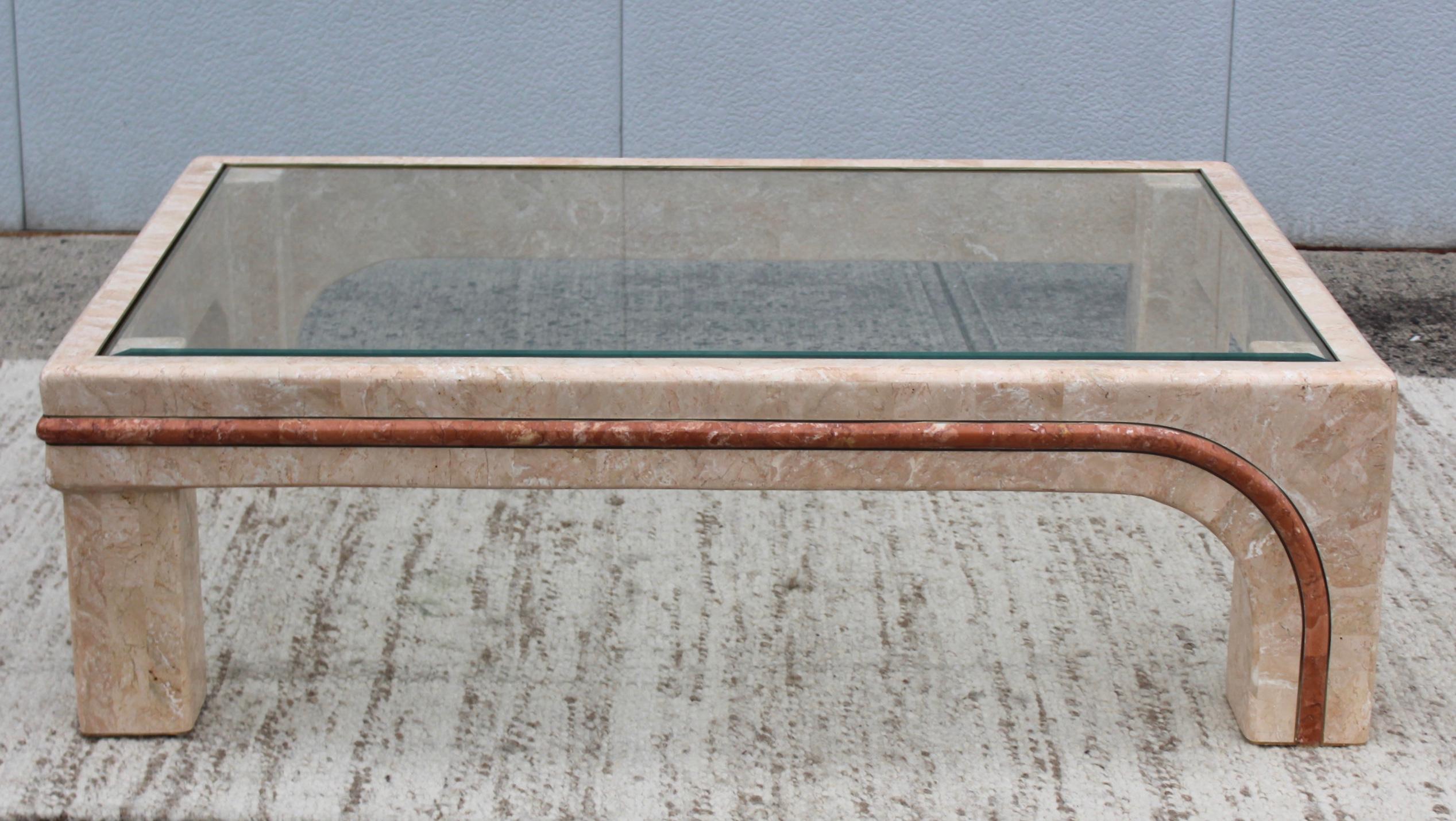 Stunning oversize tessellated stone with brass detail coffee table attributed to Maitland Smith.