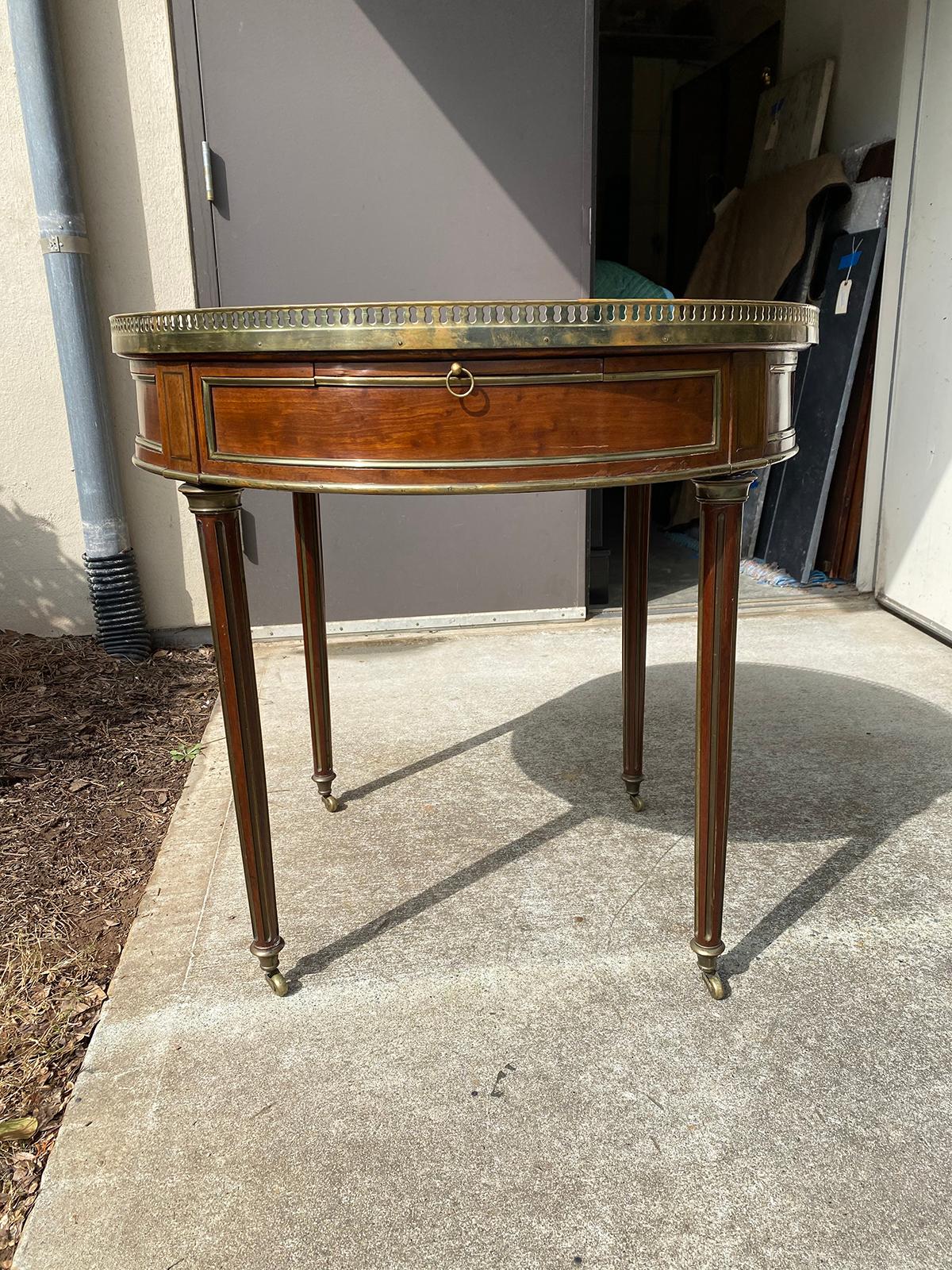 Large 19th-20th century French Louis XVI Bouillotte table with bronze mounted gallery, marble top, stamped 