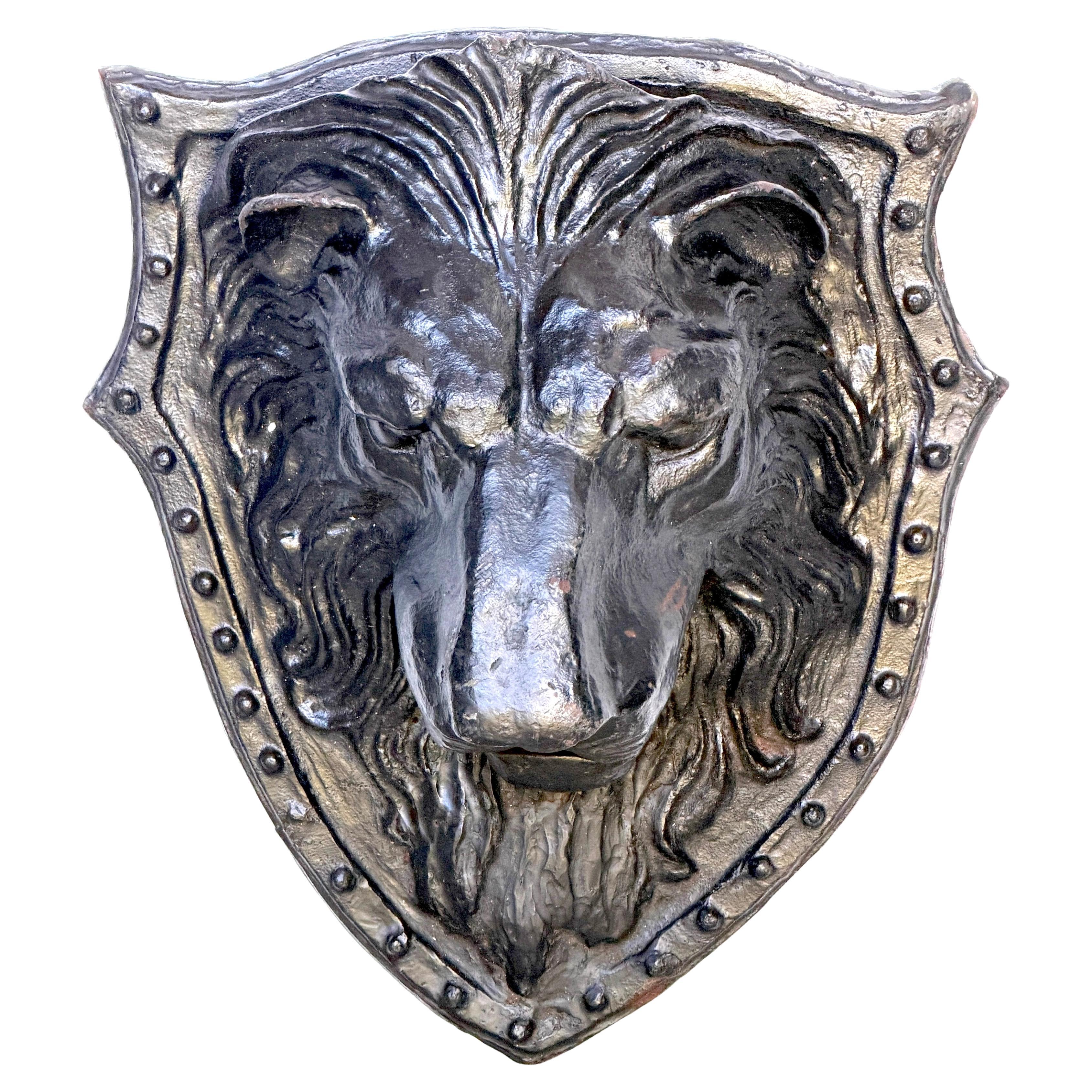 Large 19th-Century American Cast-Iron Lion Shield Medallion, Architectural Ornament

An imposing and sculptural late 19th-century American cast-iron lion medallion, modeled in deep high relief and mounted on a heraldic shield backplate. Measuring an