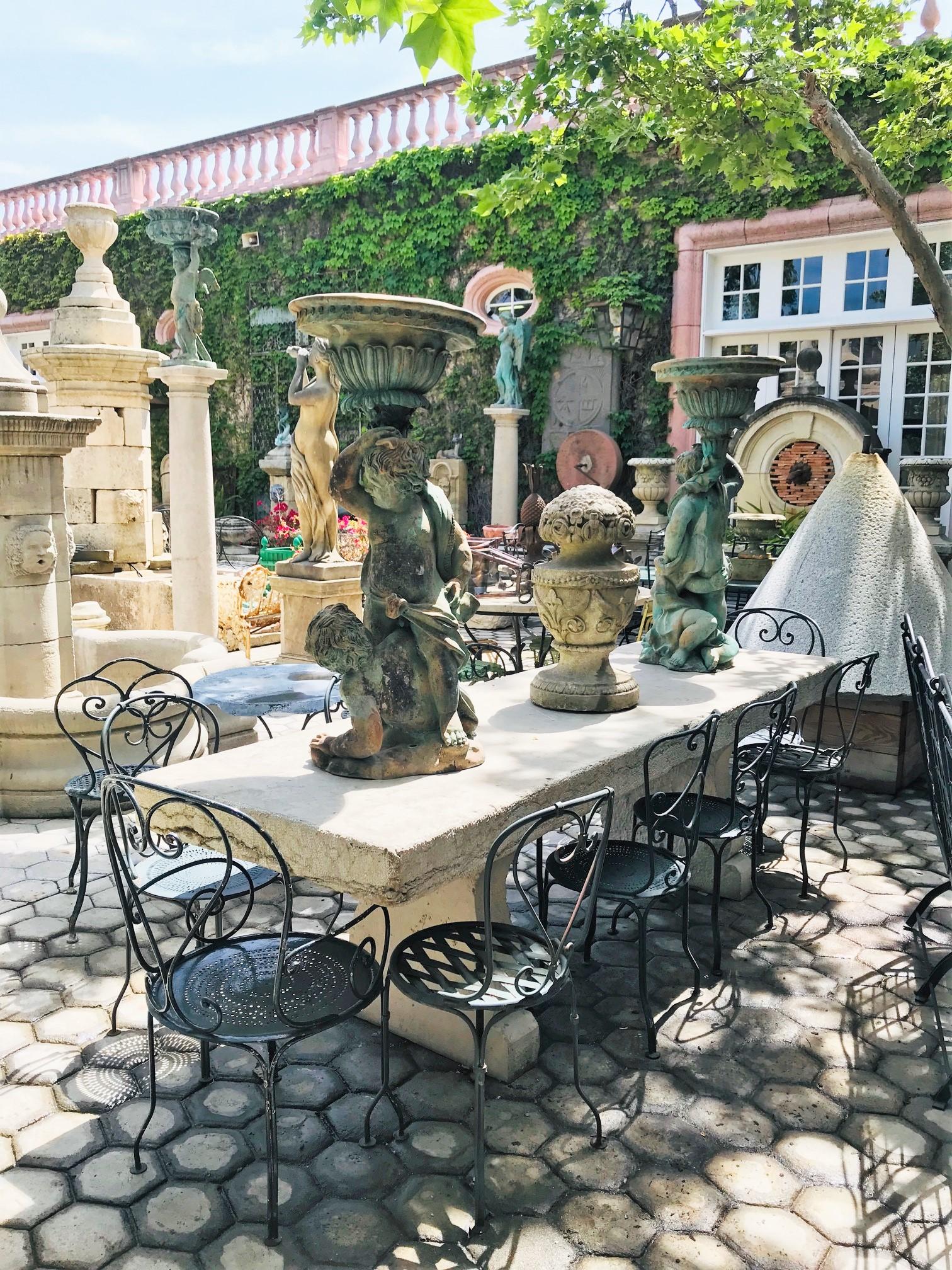 Beautifully carved and large 19th-early 20th century elements carved stone antique garden dining outdoor indoor table. It sits 10 people. It is the perfect touch by an outdoor fireplace, this table has a lot of charm and character. To have it on