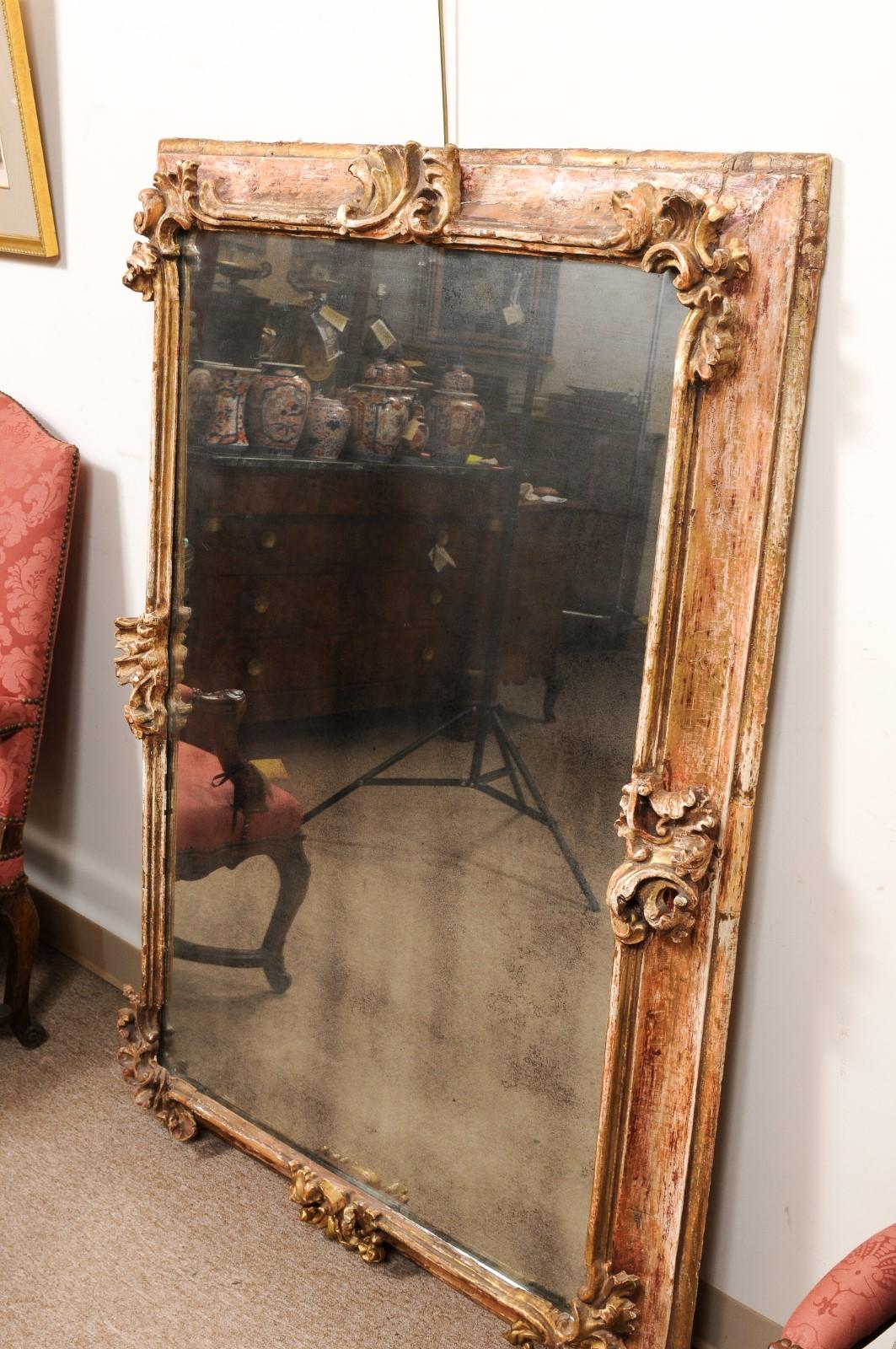 19th Century  Large 19th C Continental Rococo Style Mirror w/ Stripped Gilt /Red Gesso finish For Sale