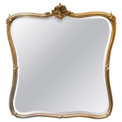 Large 19th c. French Louis XV Giltwood Shaped Mirror