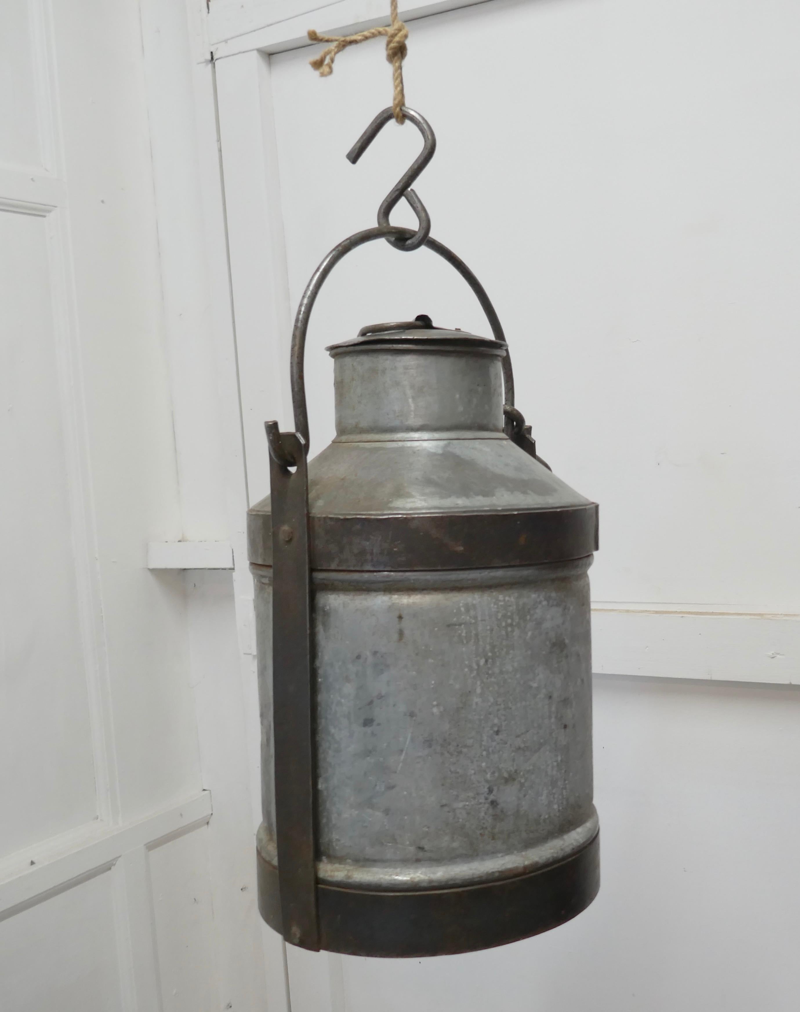 Large 19th century galvanised metal milk churn with iron strapping

A good large piece, with handle and 2 hanging hooks, made in galvanised metal with a removable lid

A very good looking decorative piece
ND56.
     