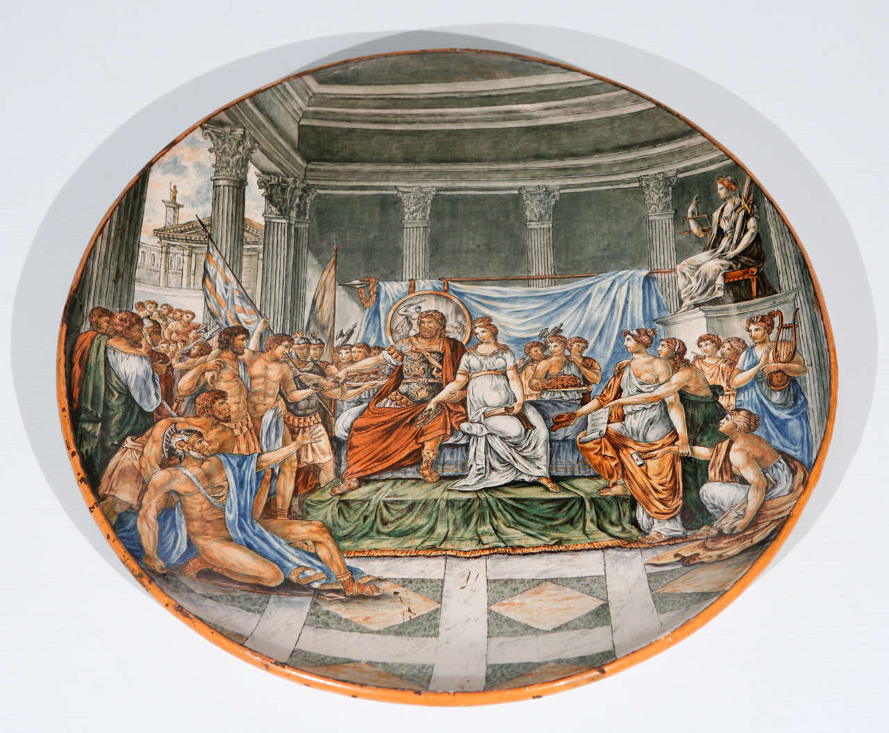 A stunning large Majolica charger depicting a Roman emperor and his court.
Laurel leaves being awarded to victors in Rome were symbols of martial victory, crowning a successful commander during his triumph.