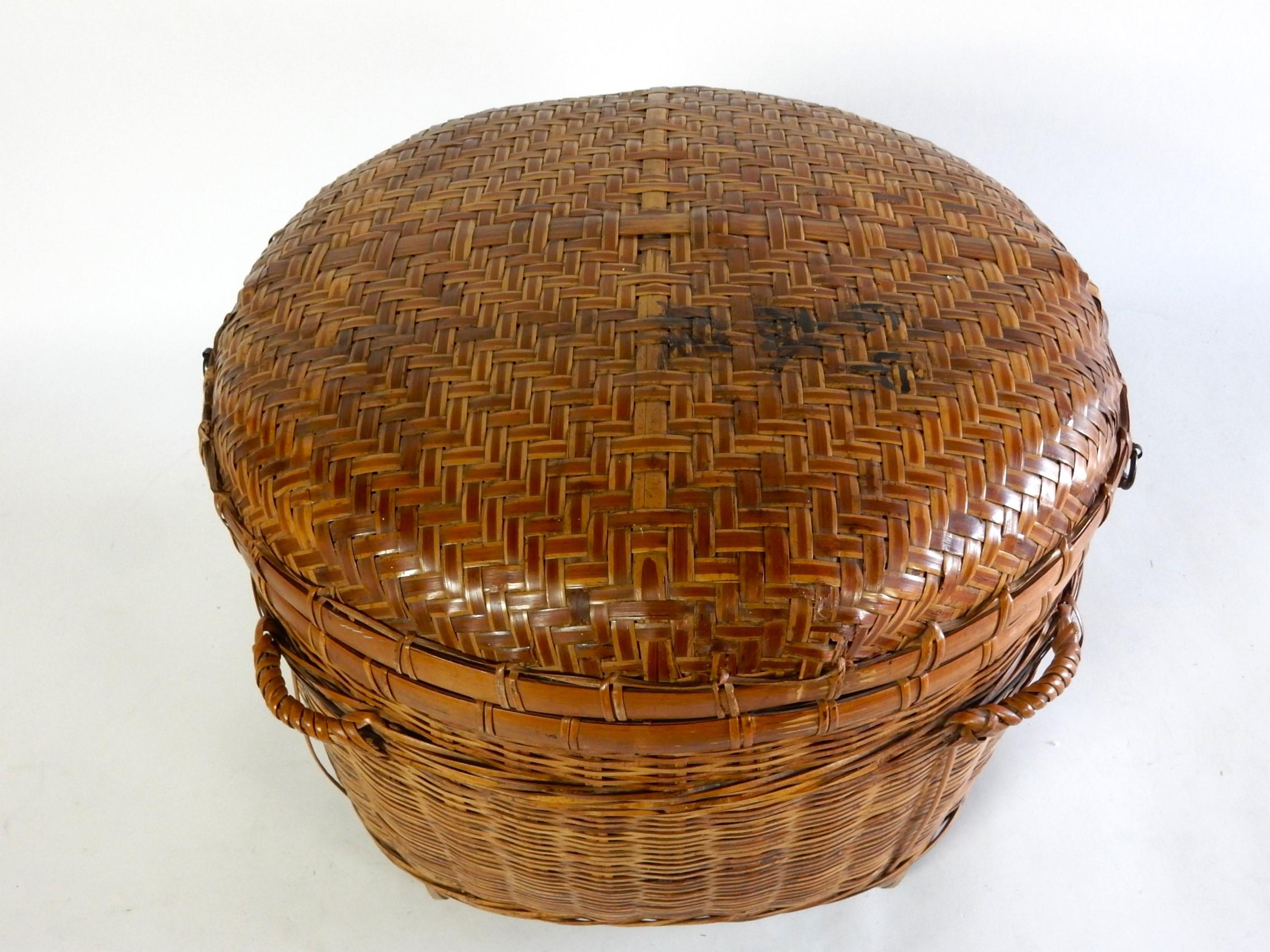 19th century Qing period Chinese storage basket intricately hand woven with bamboo and cane. Iron hinges and pull.
Measures 20