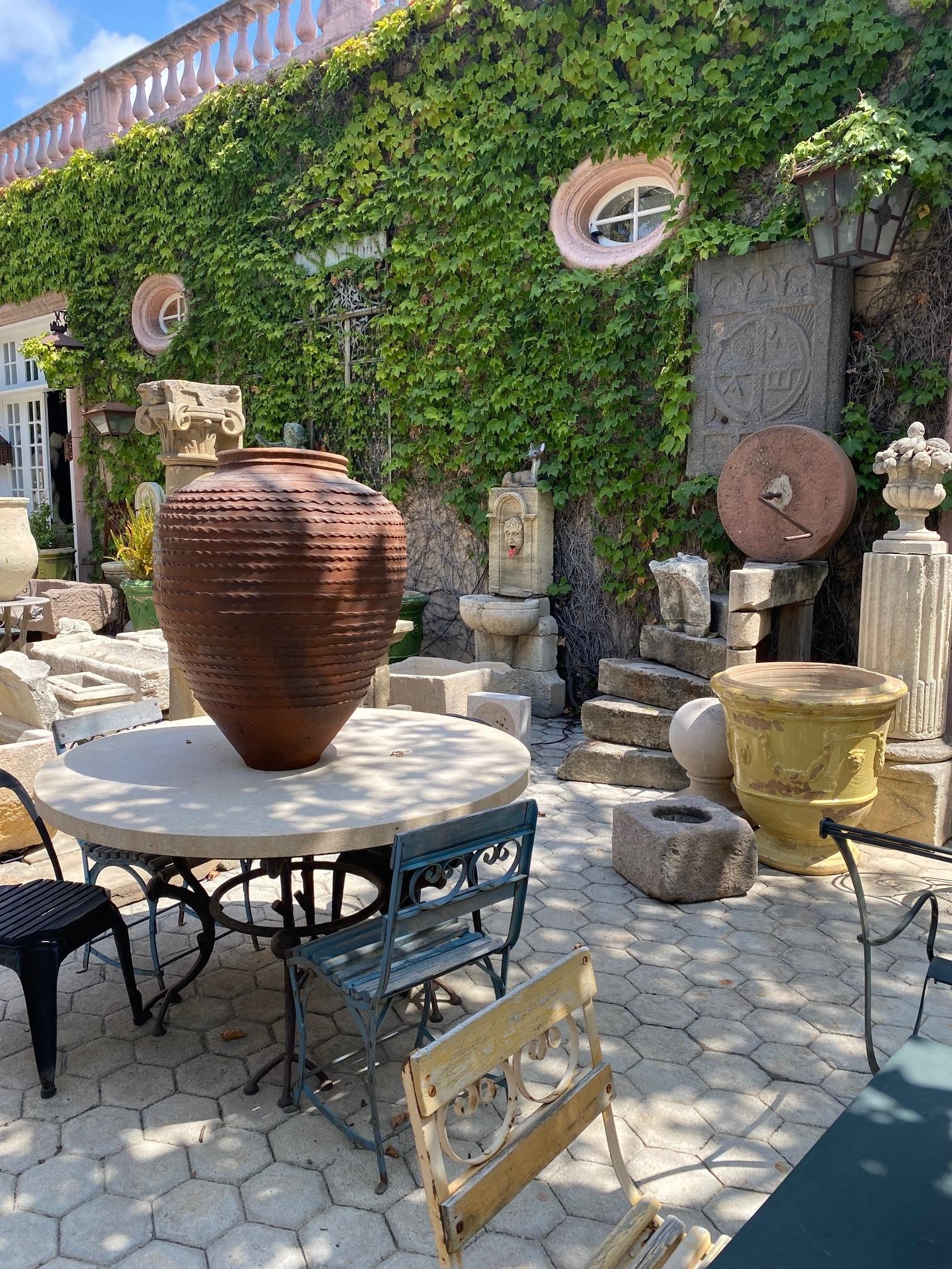 Outstanding Spanish olive oil jar in beautiful terracotta. A terrific accent piece for any interior or exterior .Terracotta vessels once used to hold olives and olive oil features a rounded lip at the top, with a bulbous centre which tapers to the
