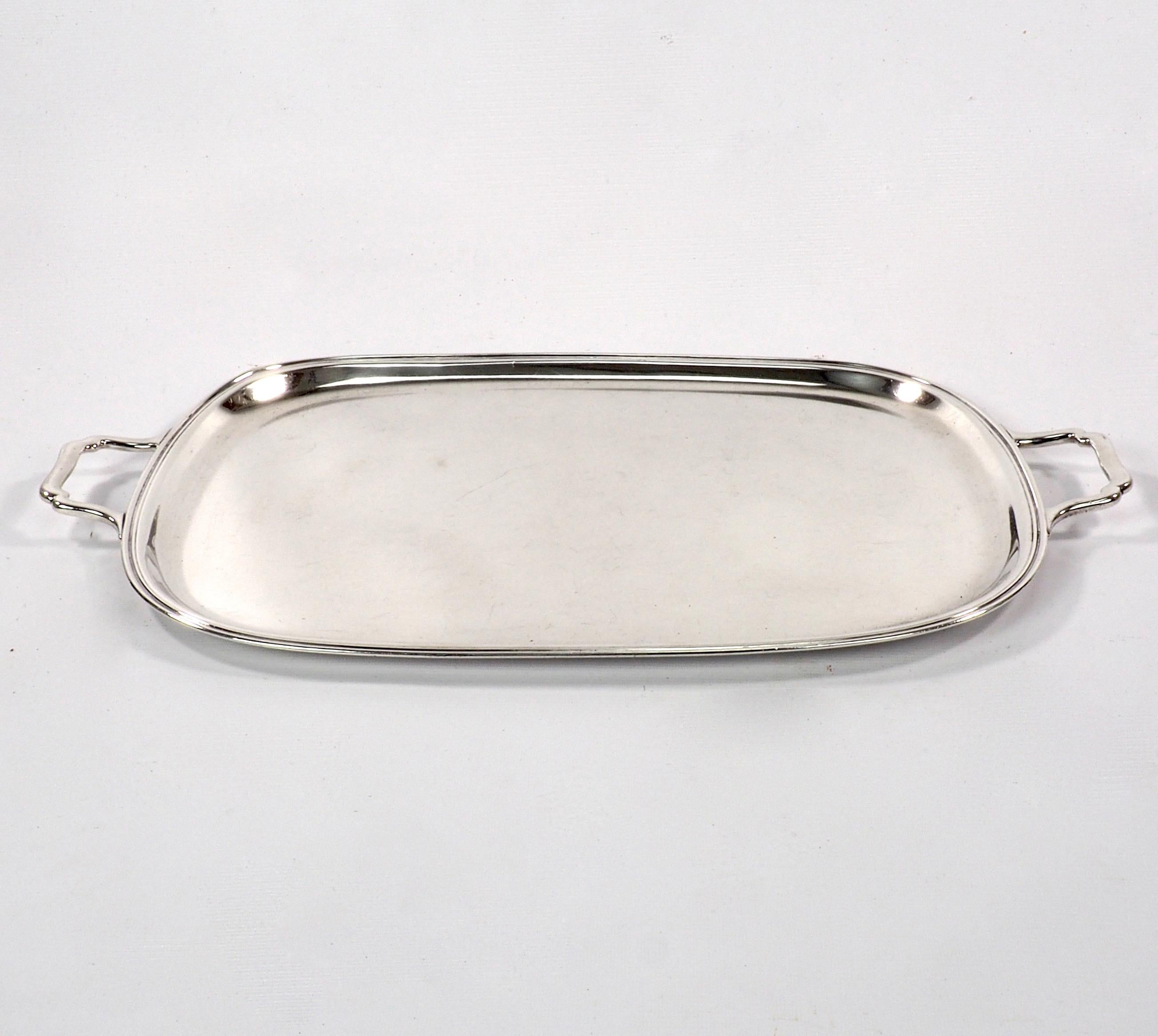 A large and important American solid sterling silver tray with elegant scrolled silver handles and deep bevelled rim. Dating from the mid 19th century. A rare example of American silverware of this date. Stamped Sterling to base and weighing in at