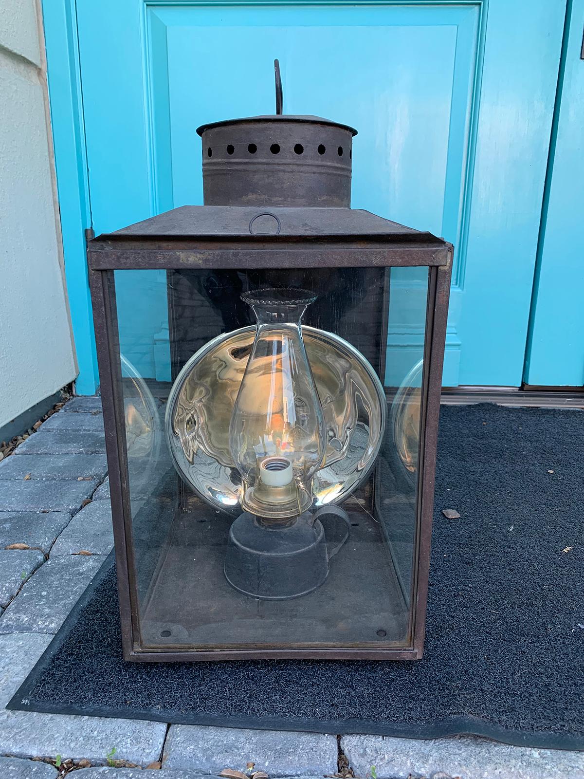 Large 19th century American tole Kerosene Lantern with mercury glass eeflector.
Brand new wiring.