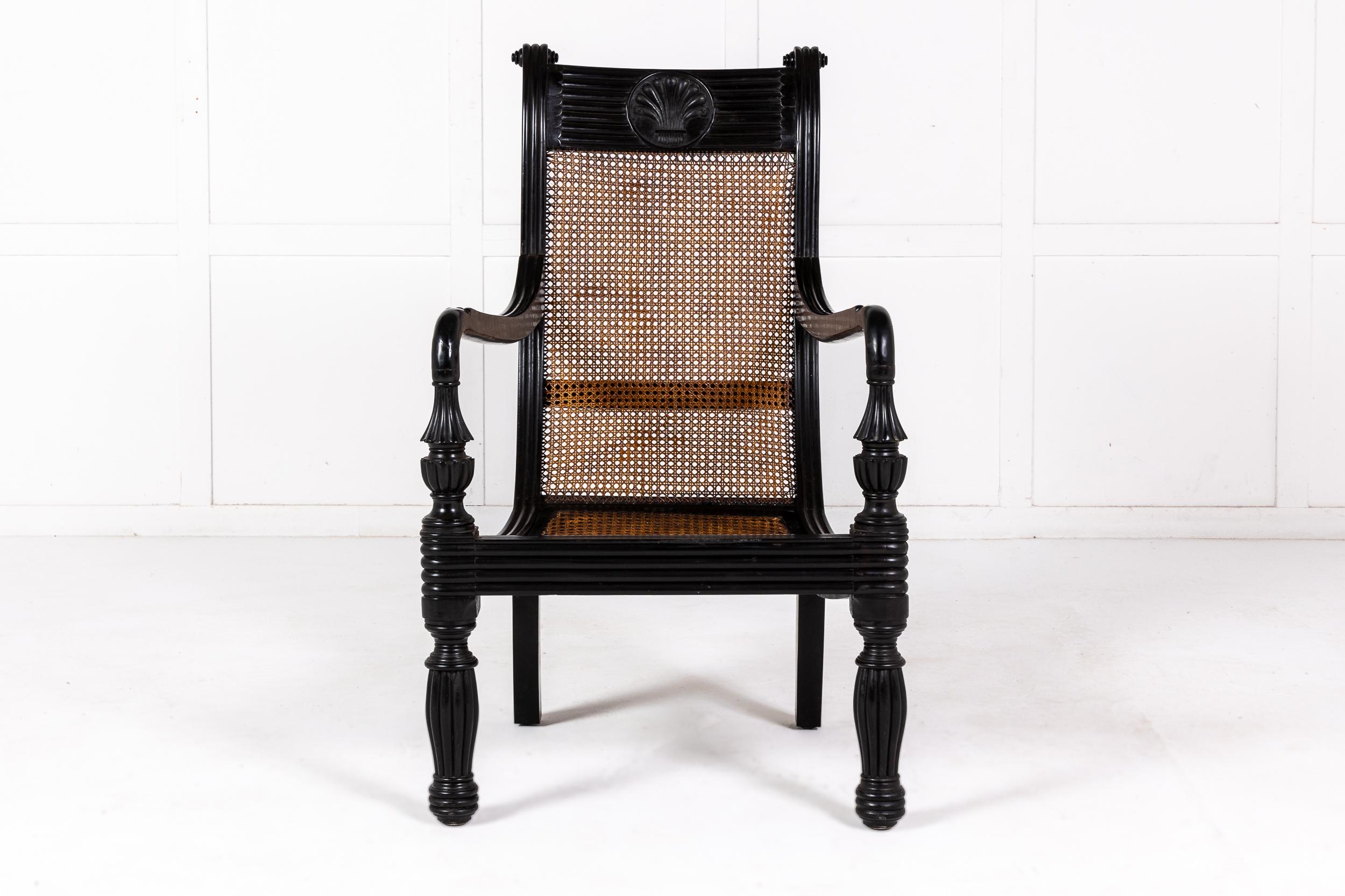 An Interesting and Large Scale Anglo-Indian Solid Ebony Armchair c.1845.

Made in India or Ceylon most likely for the British Market or perhaps for a British official based in the country, this armchair is of extremely grand imposing proportions