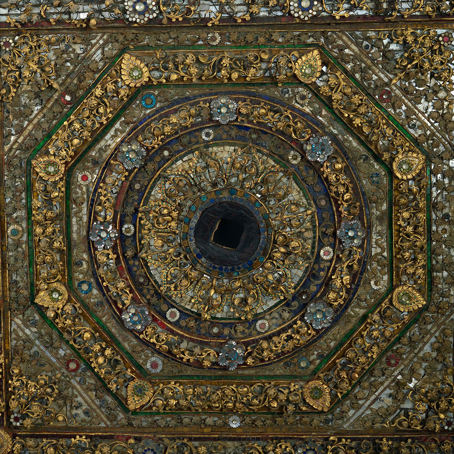 A 19th century large and very decorative panel, probably originally the central panel of an elaborate ceiling in a temple or bell house. Formed of intricately designed pieces of wire work, mozaic mirror, colored glass and gem stones. This decorative