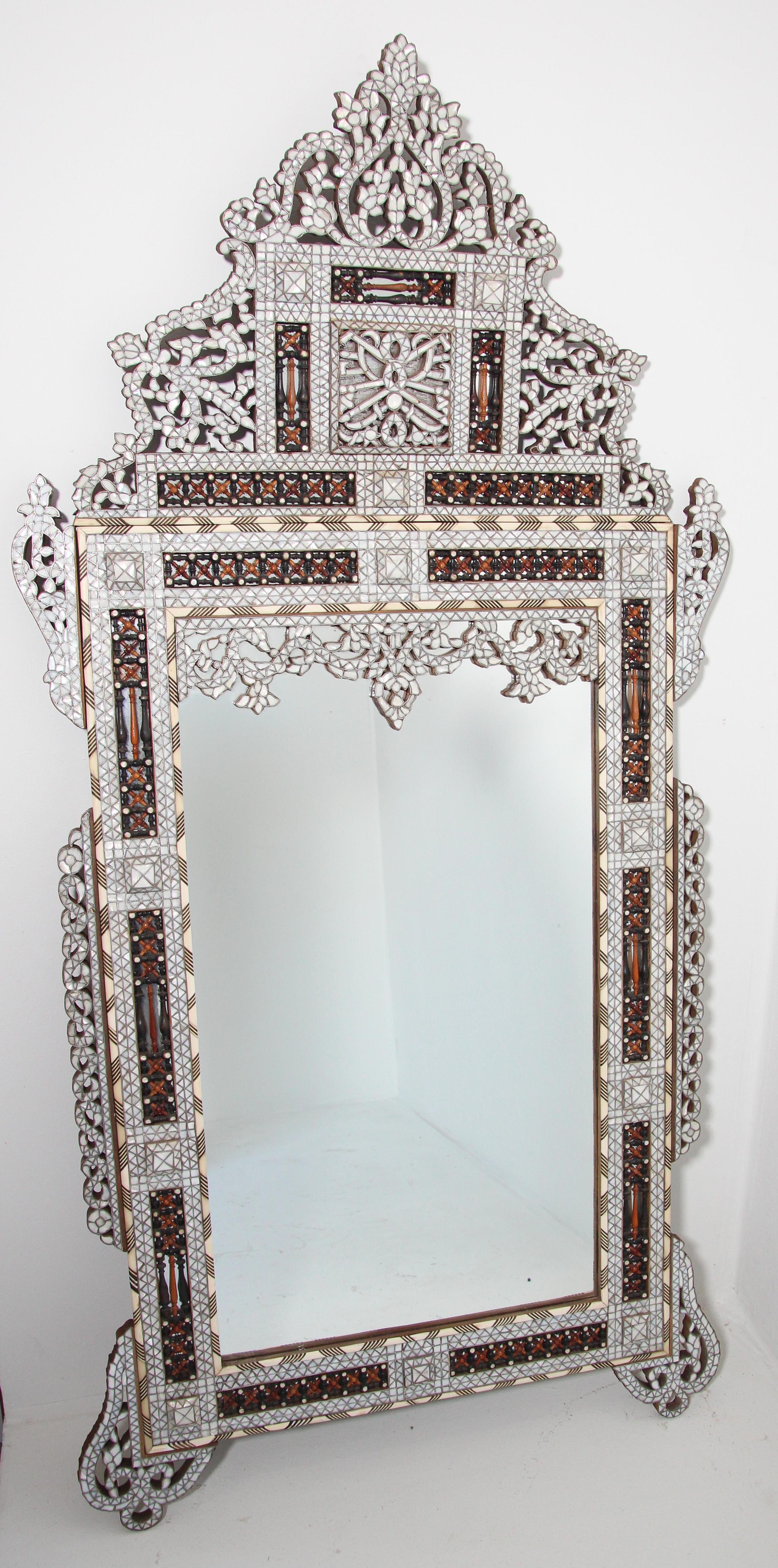 Levantine Middle Eastern Moorish Damascene Syrian antique Mirror, Late 19th Century.
White shell abalone Inlaid Middle Eastern Mirror.
Antique Middle Eastern Moorish mirror in the Turkish Syrian Ottoman style.
Sensational large Levantine finely