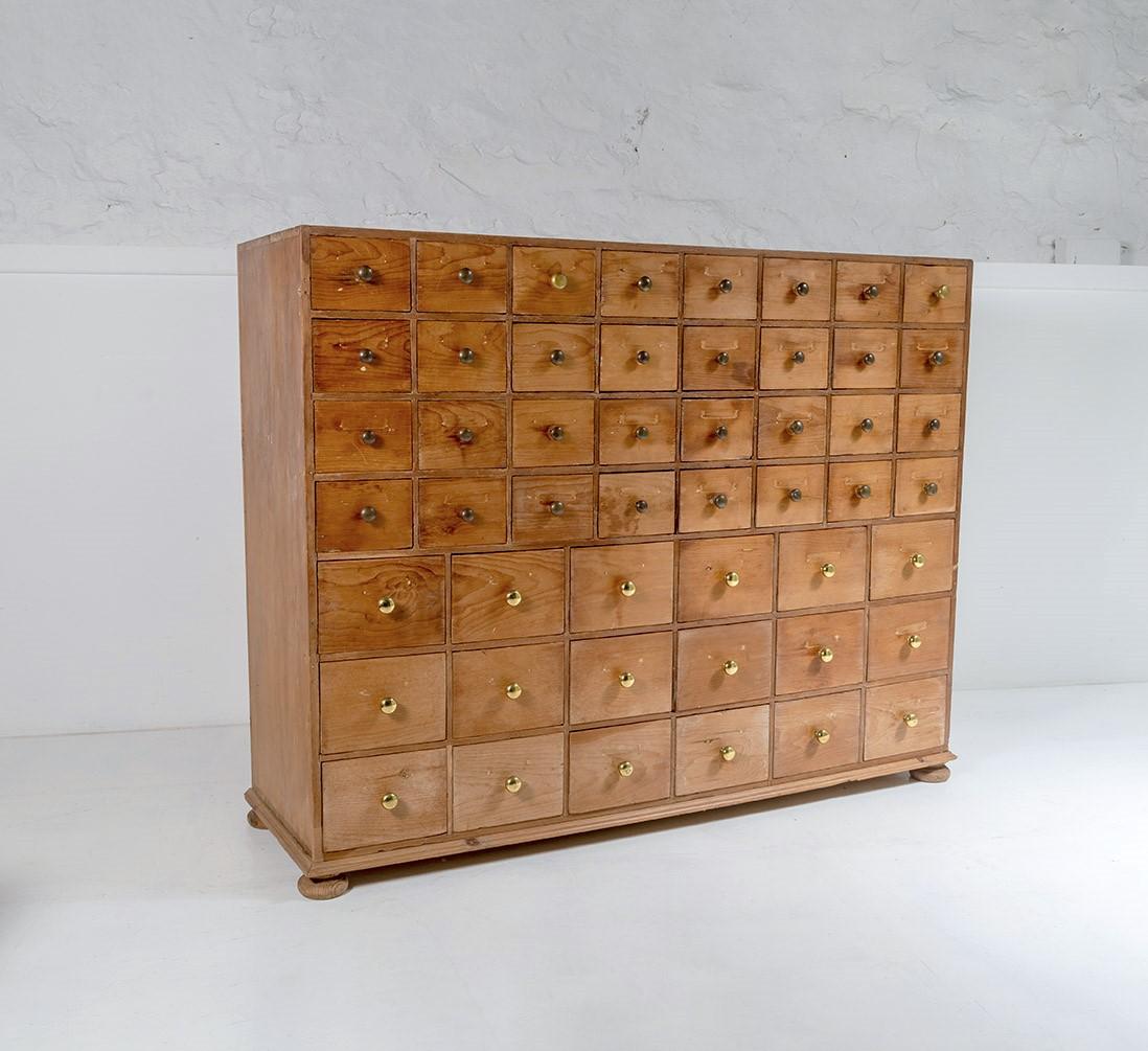 A superb original, late 19th Century Scottish seed merchant bank of drawers. 50 drawers in total in a graduated manner with 4 rows of 8 at the top and 3 rows of 6 at the bottom. At 5ft wide by 4ft tall, this is a large character piece of furniture