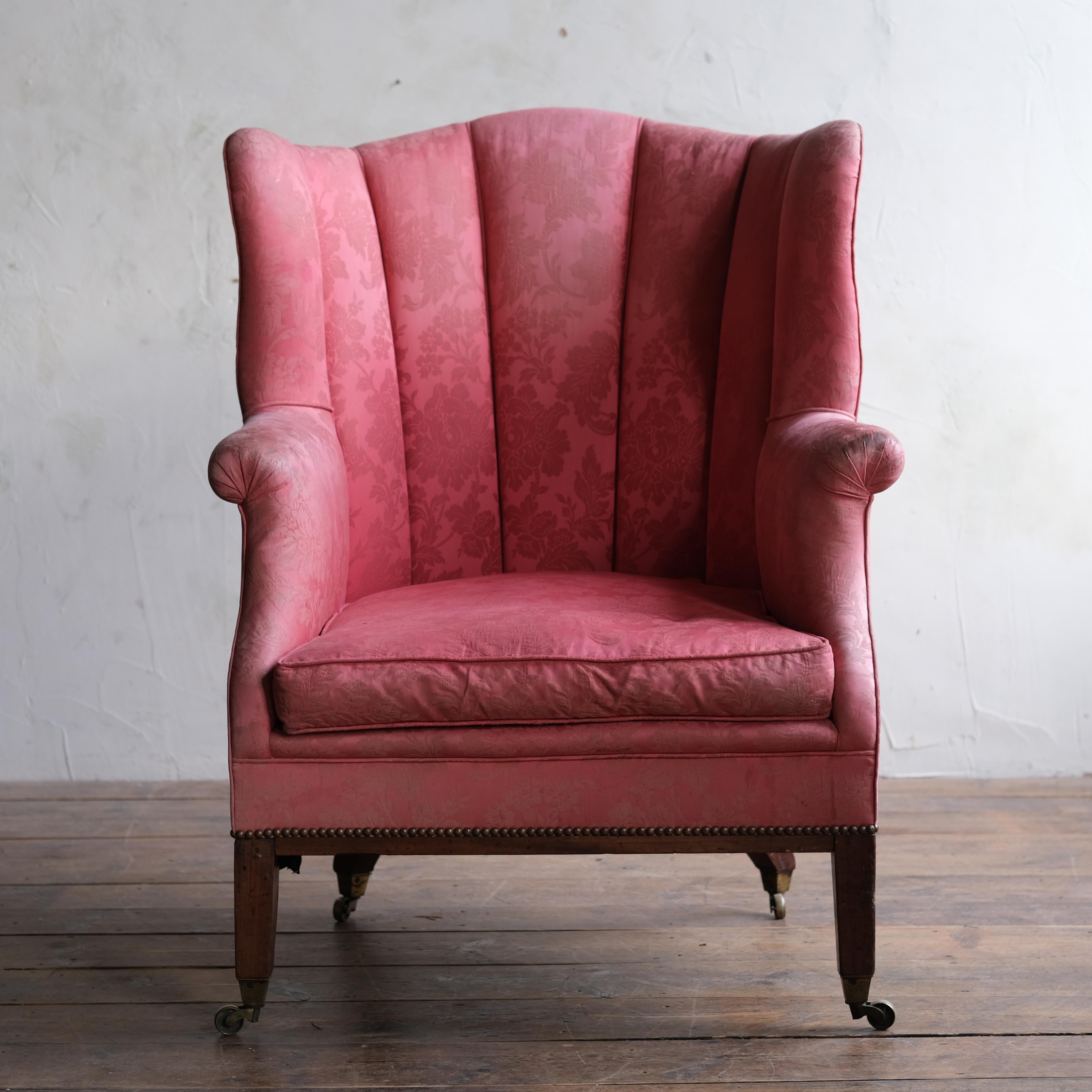A large 19th century barrel back armchair raised on square tapered legs and brass casters. In structurally solid condition with an old iron repair to the back of the right front leg but the chair stands firm. 

for upholstery. 

81cm wide

85cm