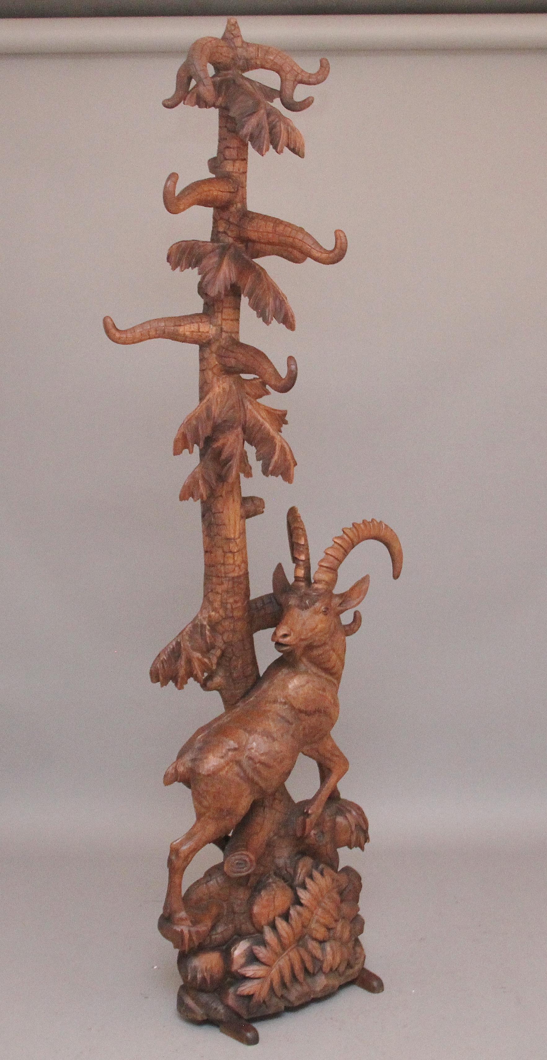 Superb quality Large 19th century black forest hall stand of an ibex amongst a tree and foliage, the tree having various branches and leaves, made of walnut the the construction is very sturdy and the branches are more than strong enough to