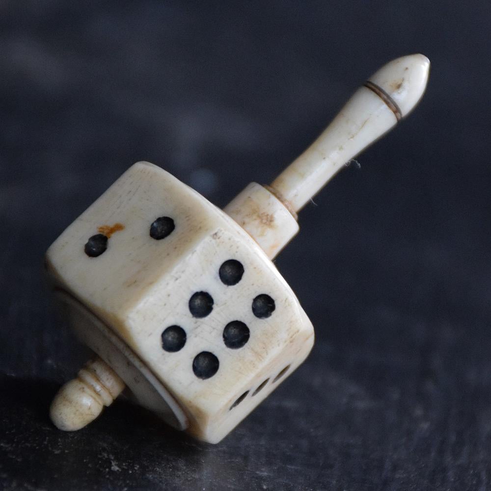 Large 19th Century Bone spinning top dice, Teetotum

19th century bone ivory 8-sided spinning top dice, teetotum. With an aged natural patination across all this item. A real collectors item.

Size in inches: H 2” x W 1” x D 1”

Period: 19th