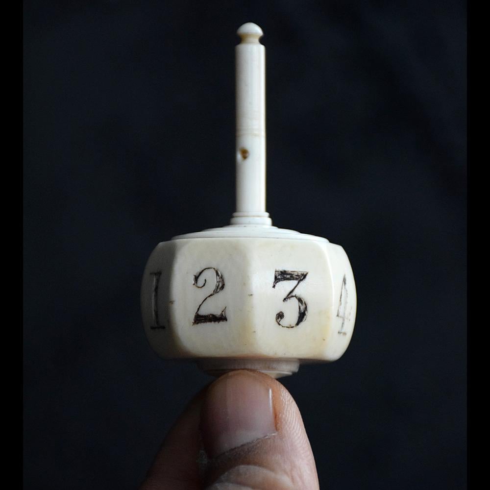 Large 19th Century Bovine 8-sided spinning top dice, Teetotum
A rare, oversized 19th century bovine ivory 8-sided spinning top dice, teetotum. This item is an unusually large size. With an aged natural patination across all this item. A real