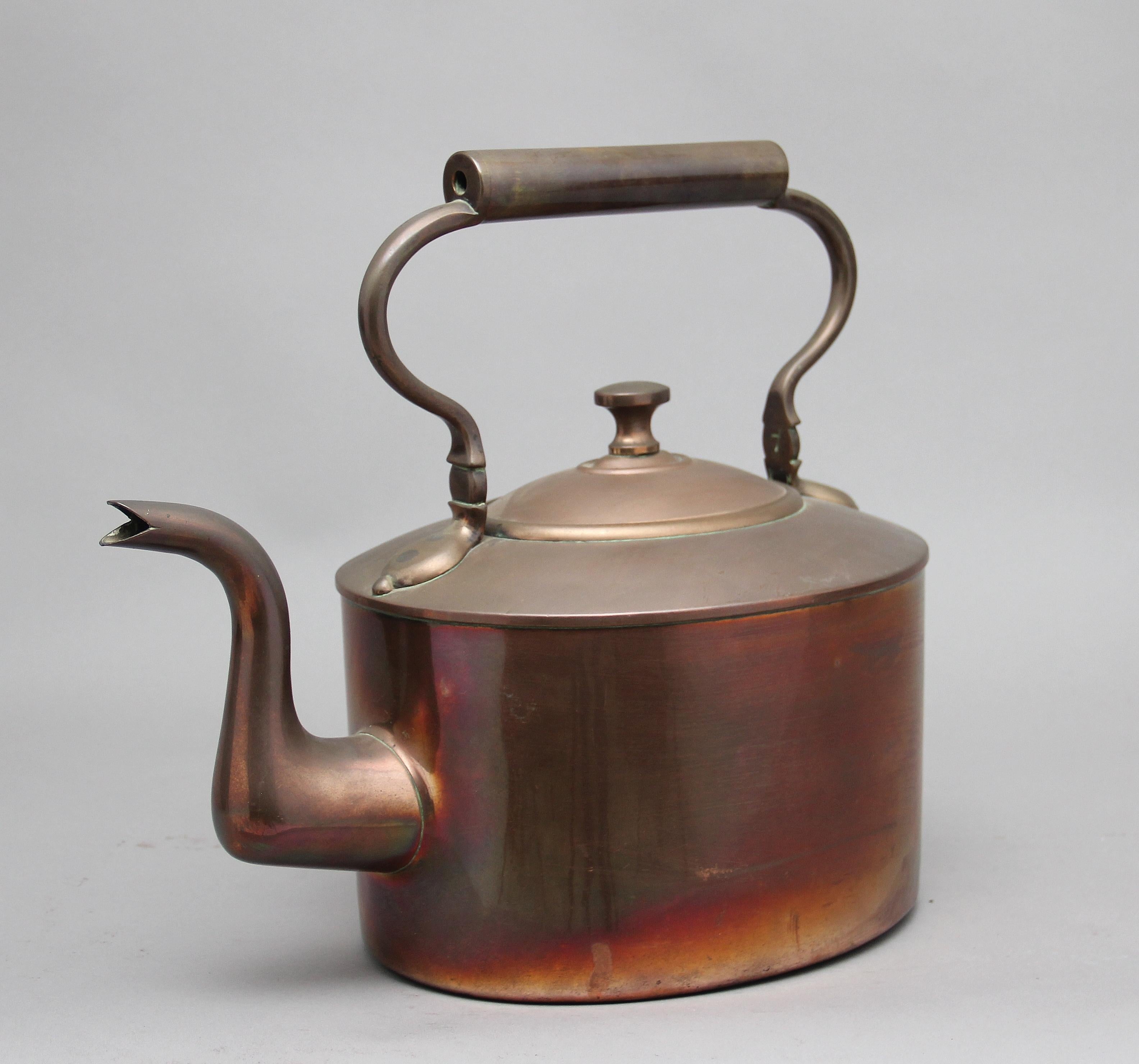 Large 19th century brass copper kettle, having a shaped handle, acorn finial on the lid and a shaped spout, circa 1860.
 
