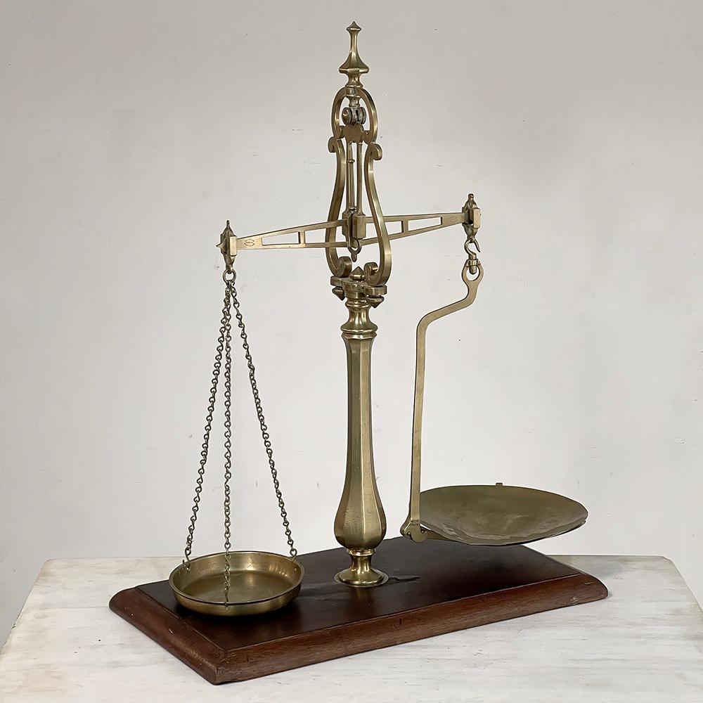 Large 19th Century Bronze Balance Scale is a wonderful example of European mercantile history!  Hand-crafted from solid bronze in an elaborate design to exude quality and refinement, it was intended for an upscale establishment that still required