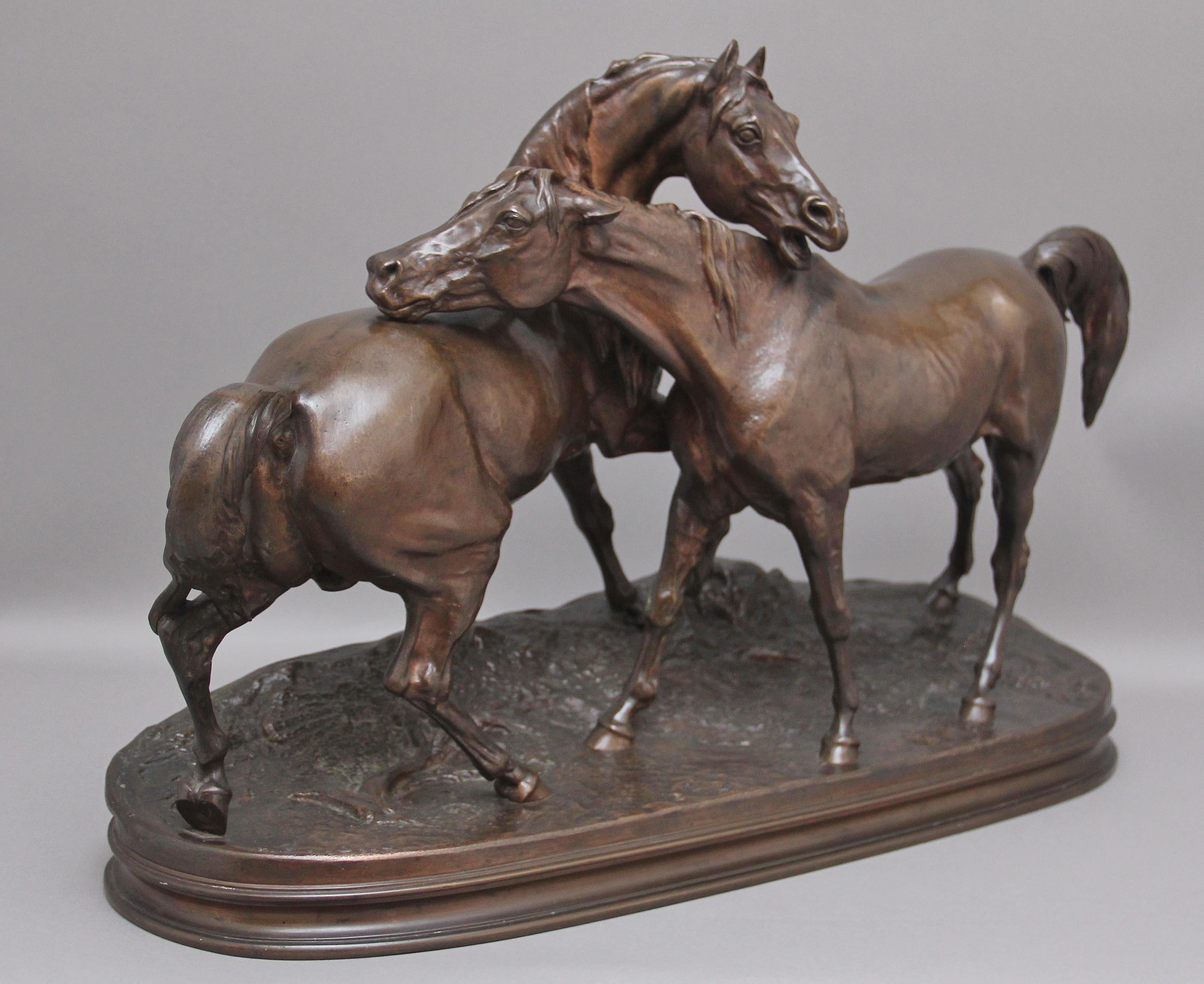 A large mid-19th century animalier bronze of the Accolade by Pierre-Jules Mene (1810-1879) Featuring an Arab stallion and Mare, superb detail throughout and having a wonderful rich dark brown patina and in excellent condition, raised on naturalistic
