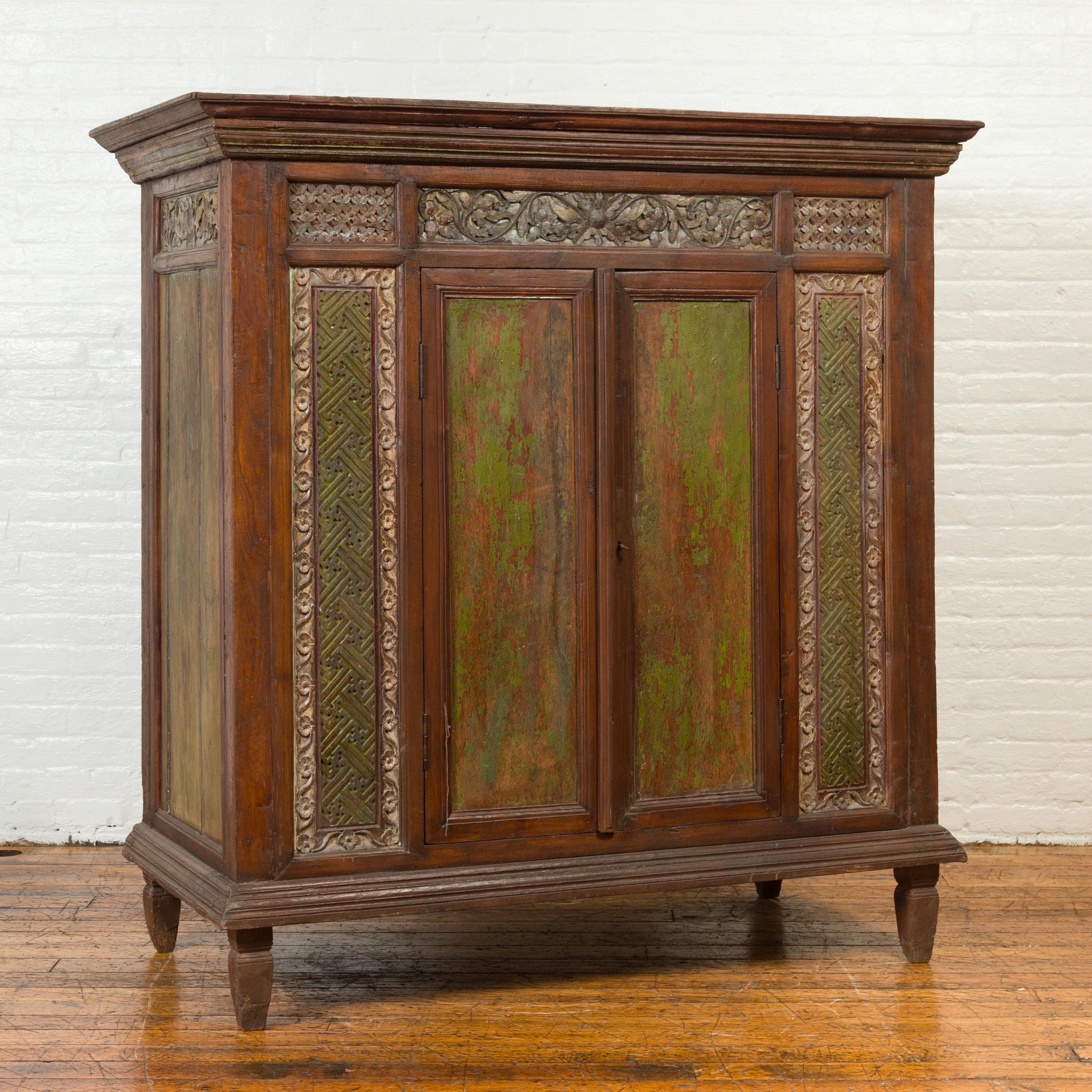 Indonesian Large 19th Century Cabinet with Carved Floral Motifs and Distressed Verde Finish For Sale