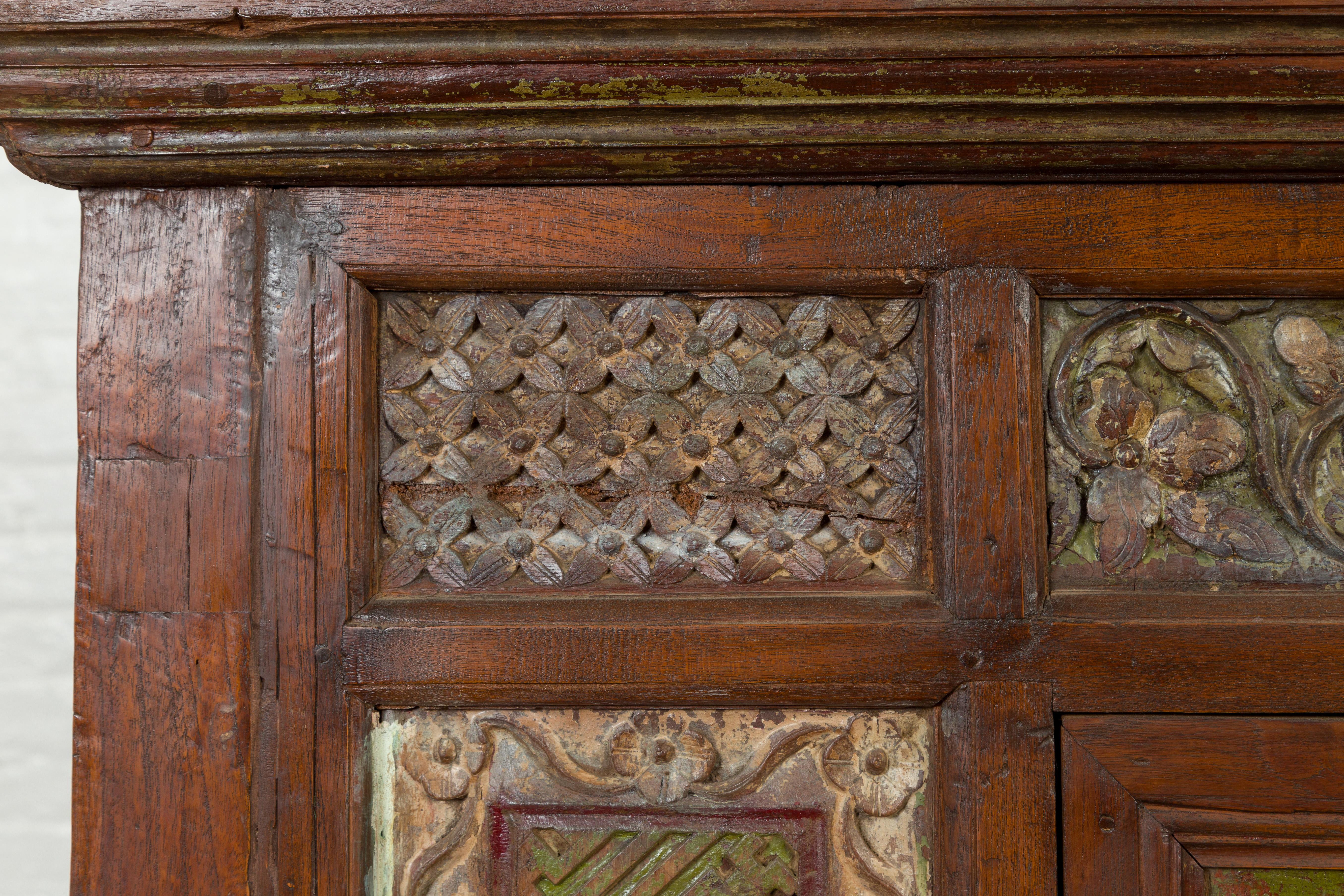 Wood Large 19th Century Cabinet with Carved Floral Motifs and Distressed Verde Finish For Sale