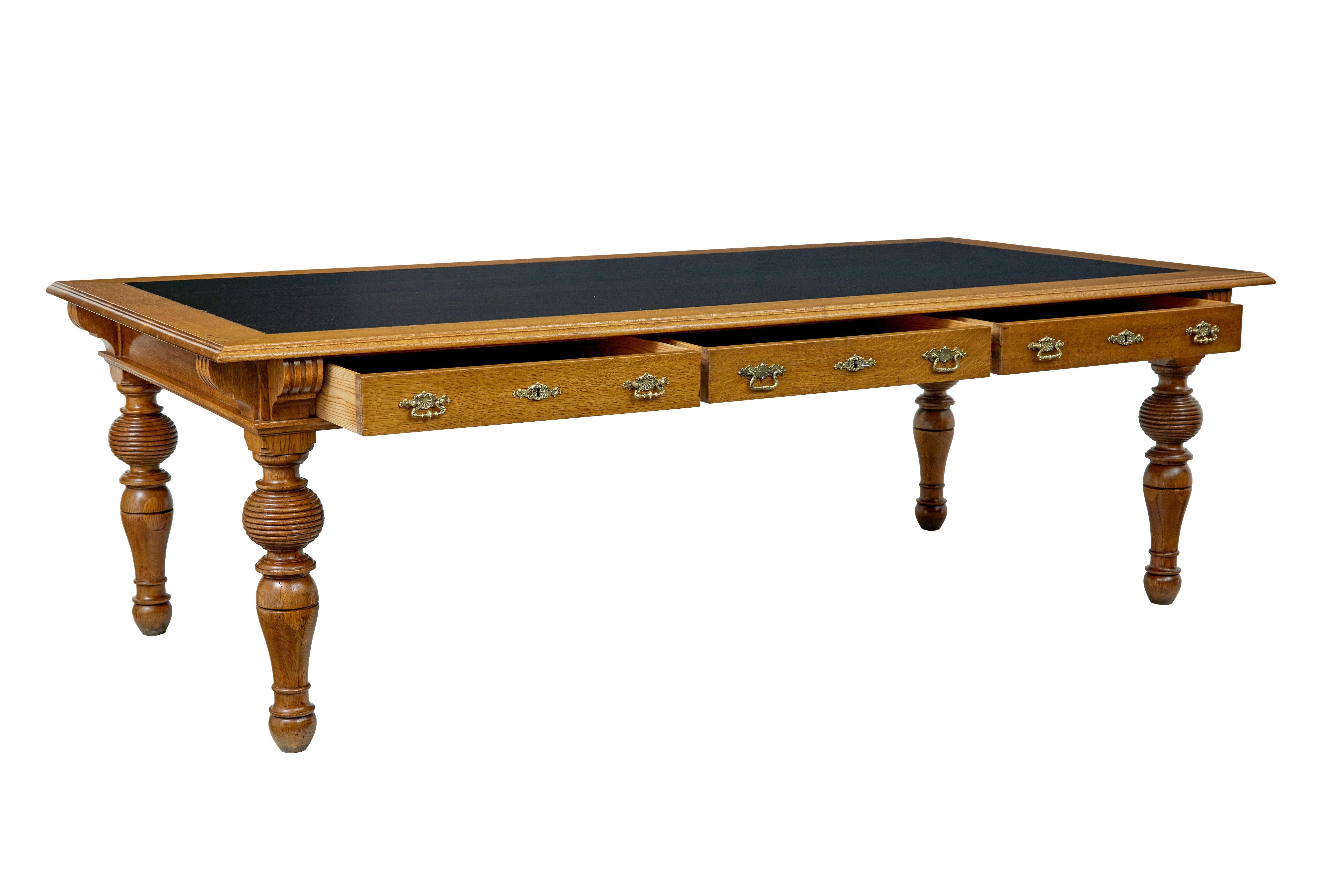 19th century carved oak library table of large proportions circa 1890.

We are pleased to offer this statement piece of furniture which would make the ultimate large desk. Black rexine inset writing surface with a moulded edge border, 3 deep drawers