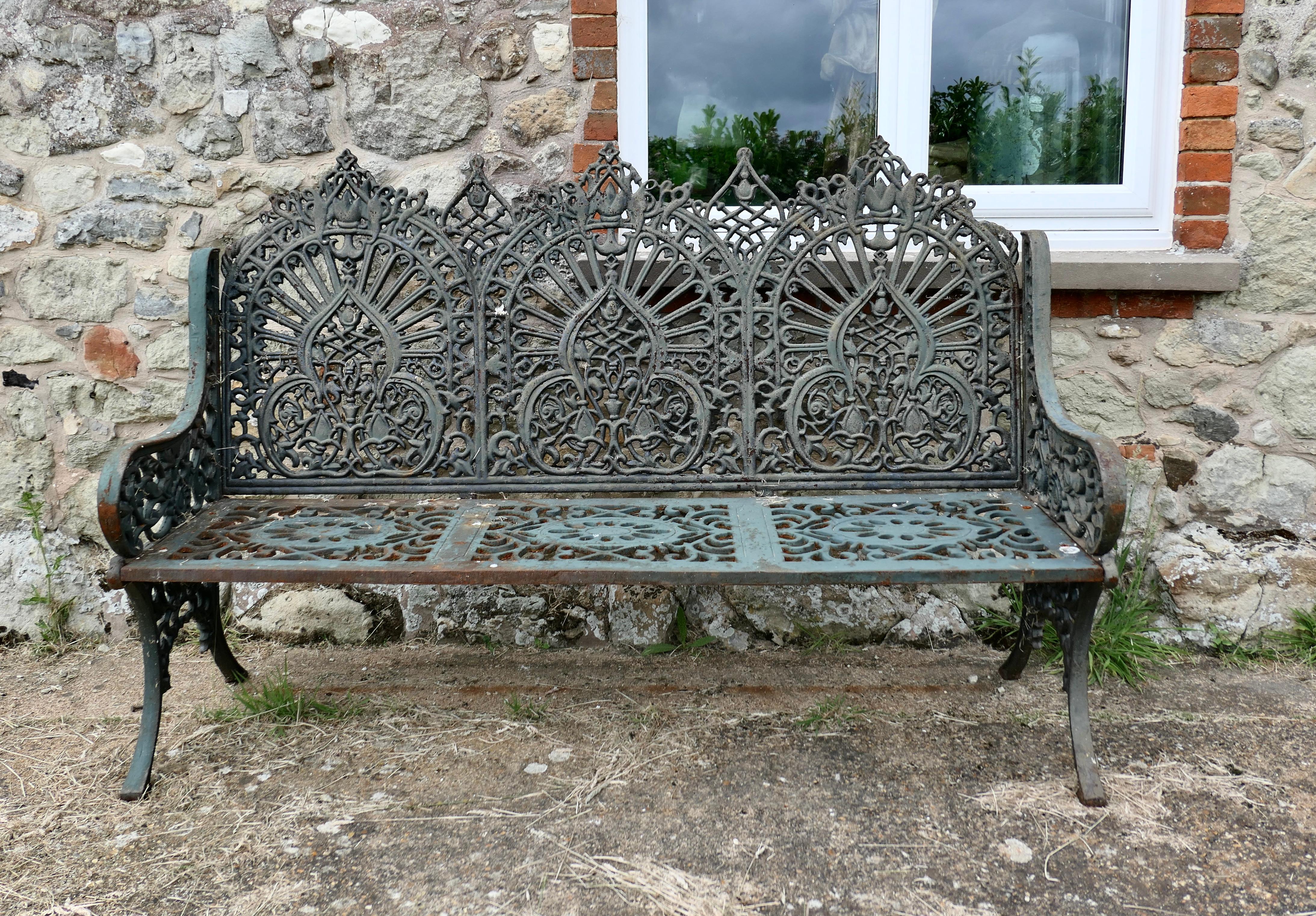 Large 19th Century Cast Iron Garden Bench 3 Seat 

This is a very decorative 19th century high quality cast iron garden seat
The bench is a roomy 3 seater, with a superbly decorative arched back, the seat itself is flat so is much more comfortable