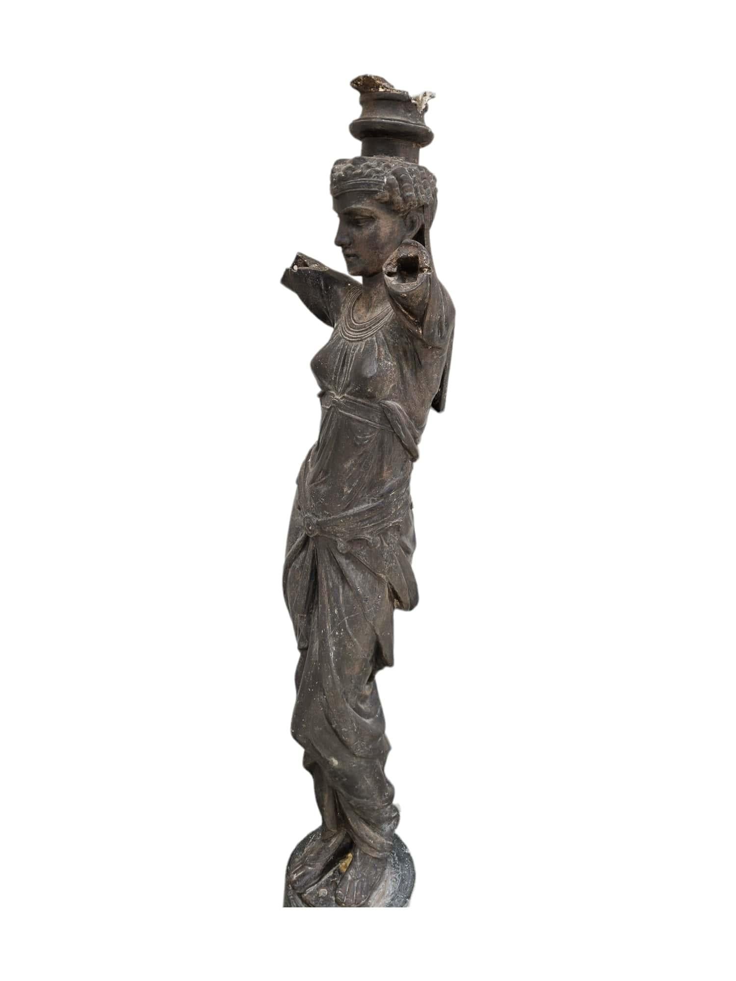 This magnificent garden sculpture, originating from France in the 19th century, stands as a testament to the craftsmanship and artistic fervor of the era. Crafted from cast iron with a marble base, it embodies the exquisite fusion of durability and