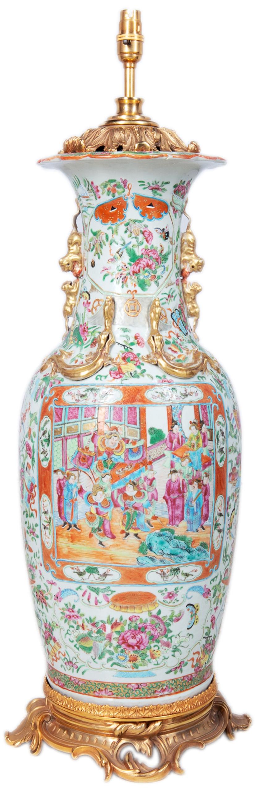 A very good quality 19th century Chinese canton / rose medallion vase / lamp, having the Classic green ground with gilded serlents and dog of faux handles to the sides. Hand painted scenes of oriental gardens, exotic birds and flowers, courtiers and