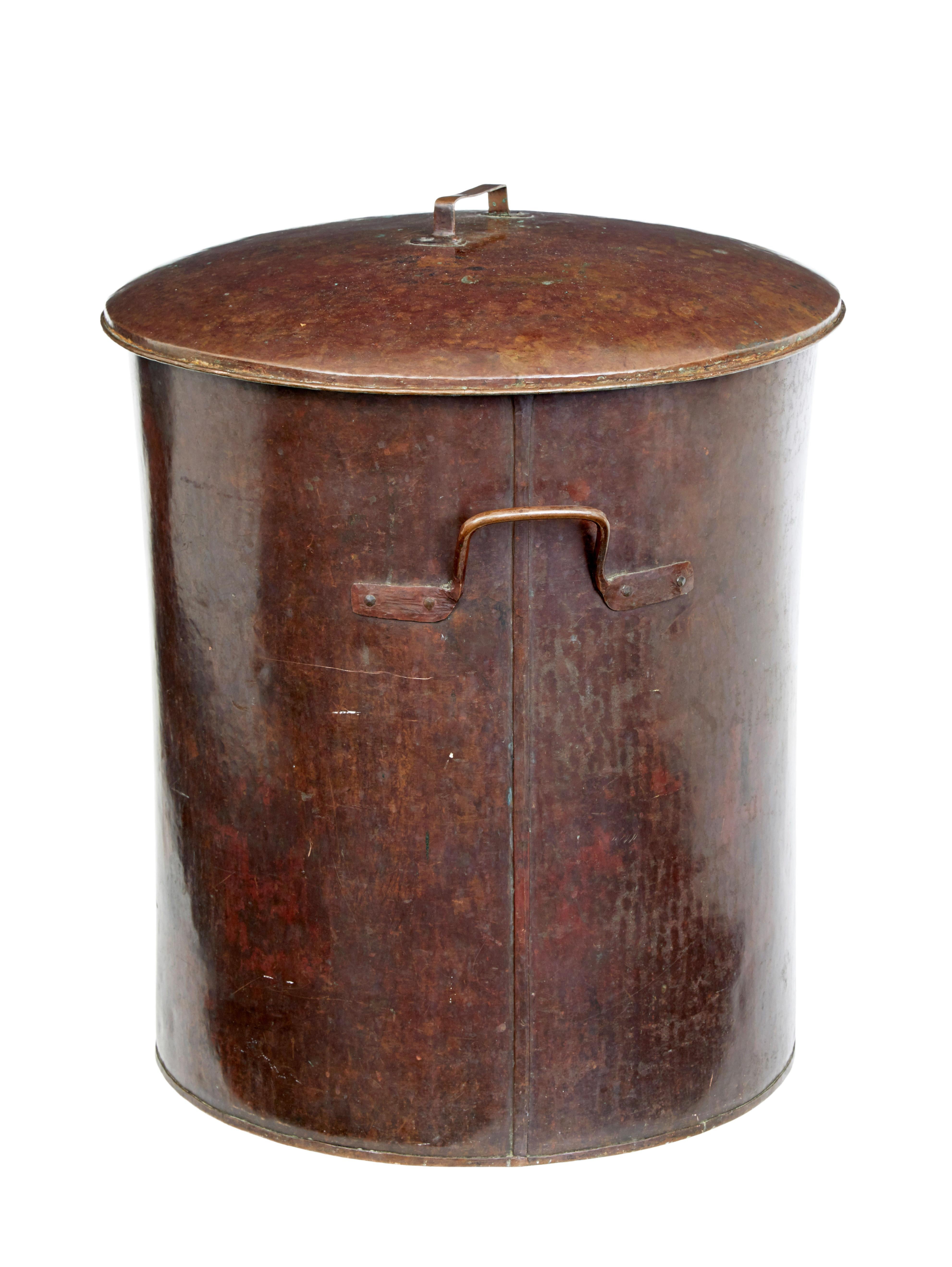 Large 19th century copper milk vessel, circa 1890.

Rare to find a piece like this with its original lid. Hand beaten to shaped with attached handles to sides and lid. Zinc lined interior. Ideal for use as a log bin or storage.

Minor surface
