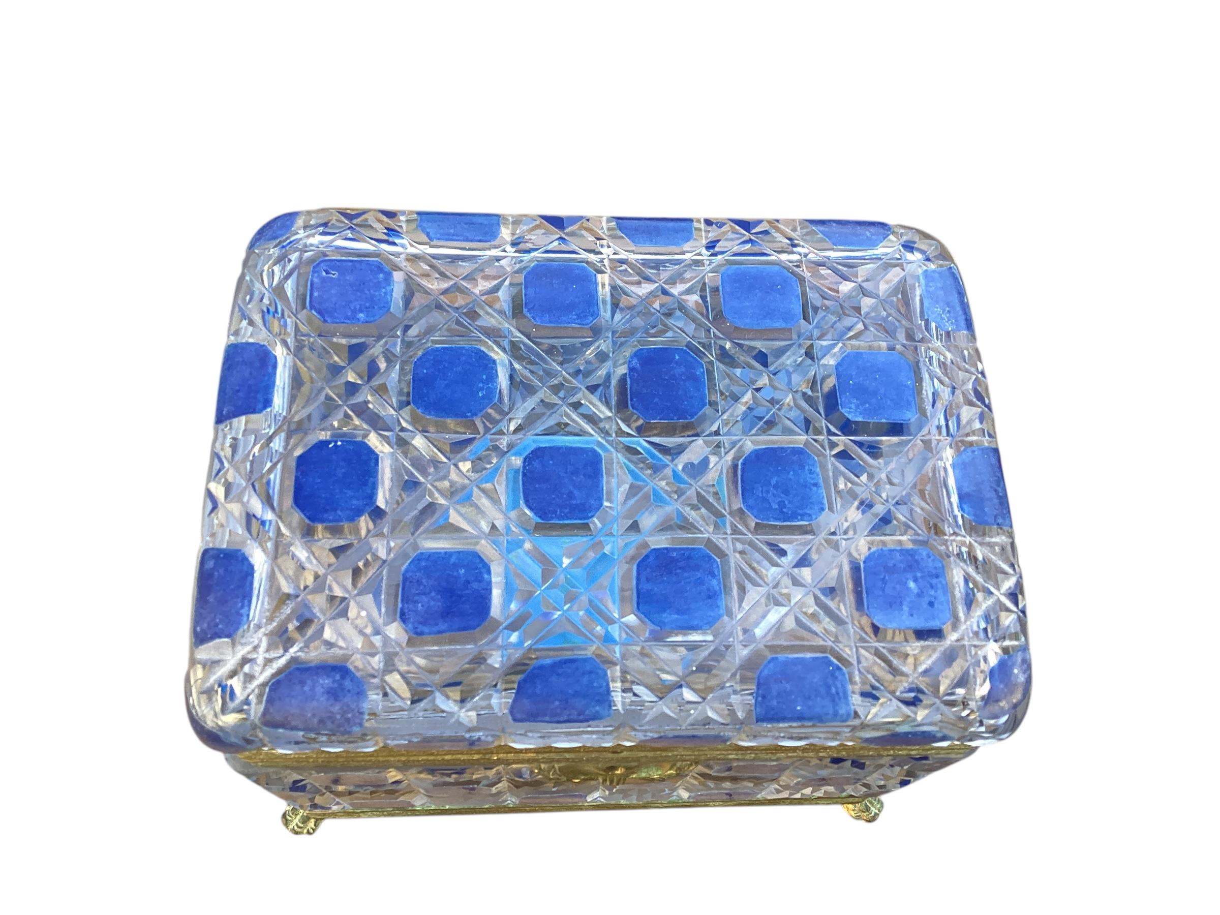 Gorgeous Large 19th Century Crystal Box with Blue Enamel Decoration and gilt fittings. Box is raised on paw feet and come with a key. Gilt fittings show signs of oxidation that can easily be cleaned but will remove the gilt finish.

