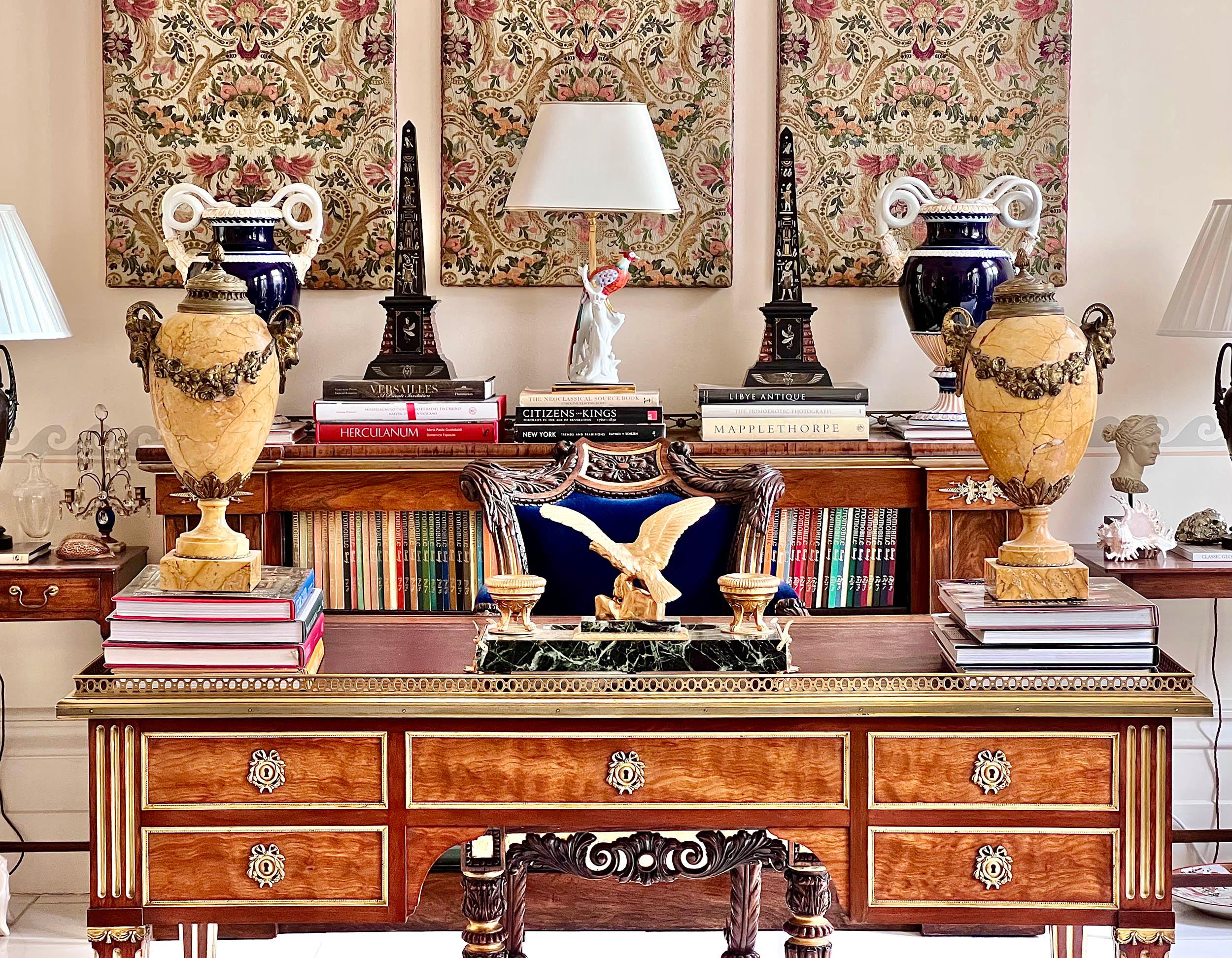 A fine quality mid-19th century Louis XVI – early Directoire style neoclassical desk, with burgundy leather lined top and exquisite brass and gilt bronze mounts.
French, circa 1860–80.

Why we like it
Its superb quality, austere neoclassical