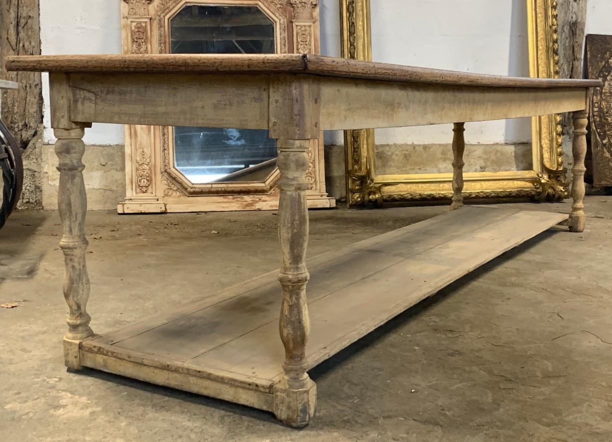A stunning large 19th century drapers table from France. With a lovely old painted base which has nice worn paint. The original wood top has a great a colour patina with nice wear.