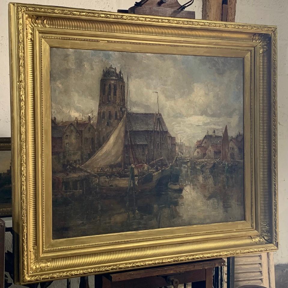 A lovely large 19th century Dutch oil on canvas of boats in its original gilded frame. Signed bottom right.