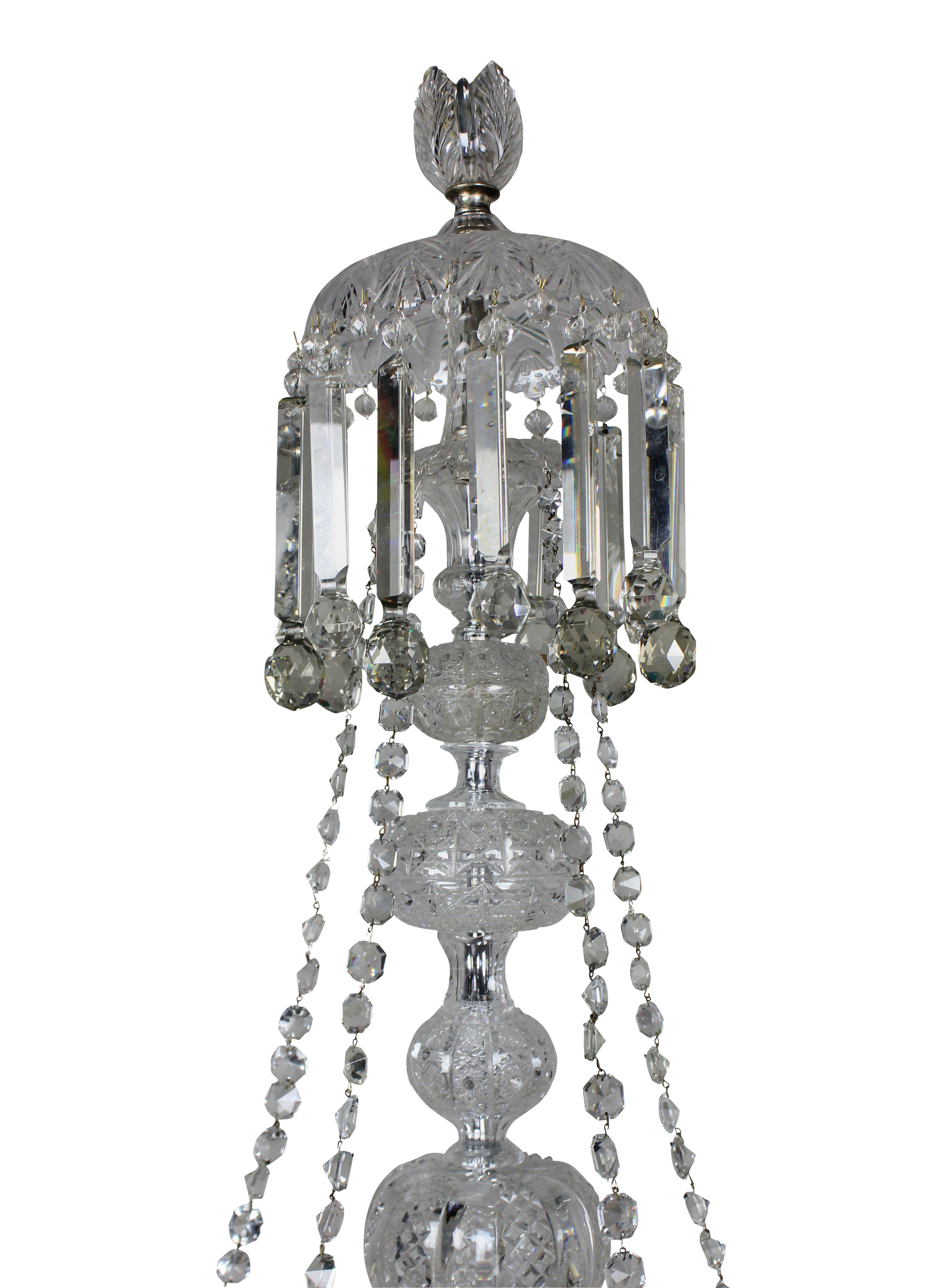 A large English cut-glass chandelier of good quality. Profusely handcut throughout, hung with good quality prism drops, formerly a gasolier.