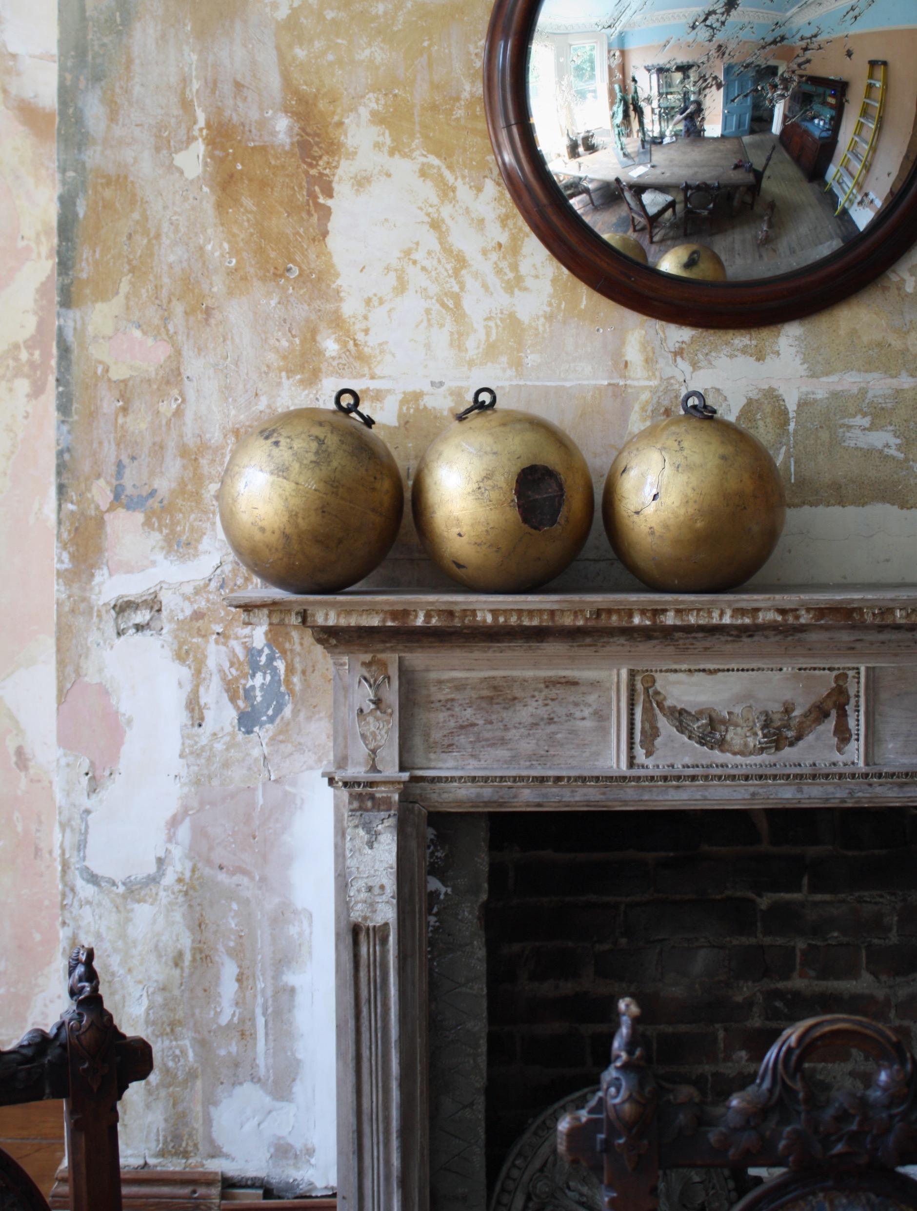 An extra large trio of oil gilt iron pawnbroker spheres, with their original hand forged hanging hoops.

Previously these would off been part of a larger sign, hanging from an iron bar. Areas of historical damage, age related wear to the gilt work.