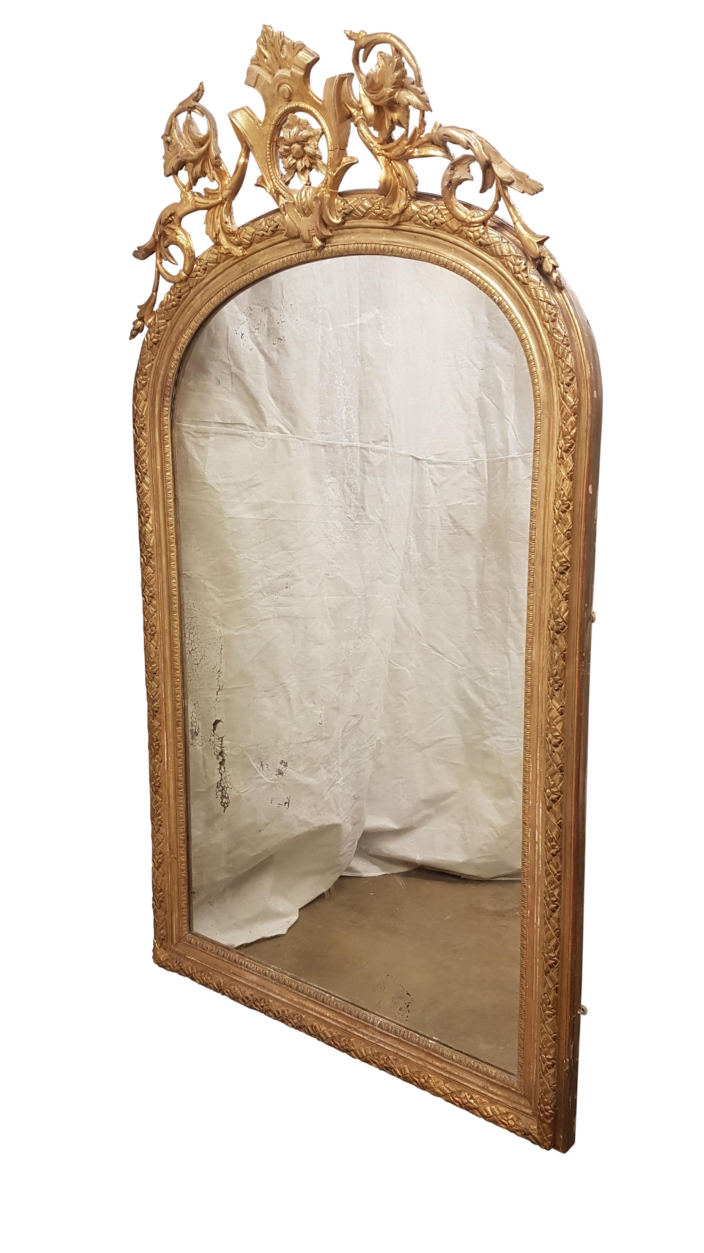 This is a stunning large 19th century English mirror with the original mercury glass plate. The Frame is in good sturdy condition but has had repairs over the years and a few areas on the pediment conserved to keep it stable. We purchased this