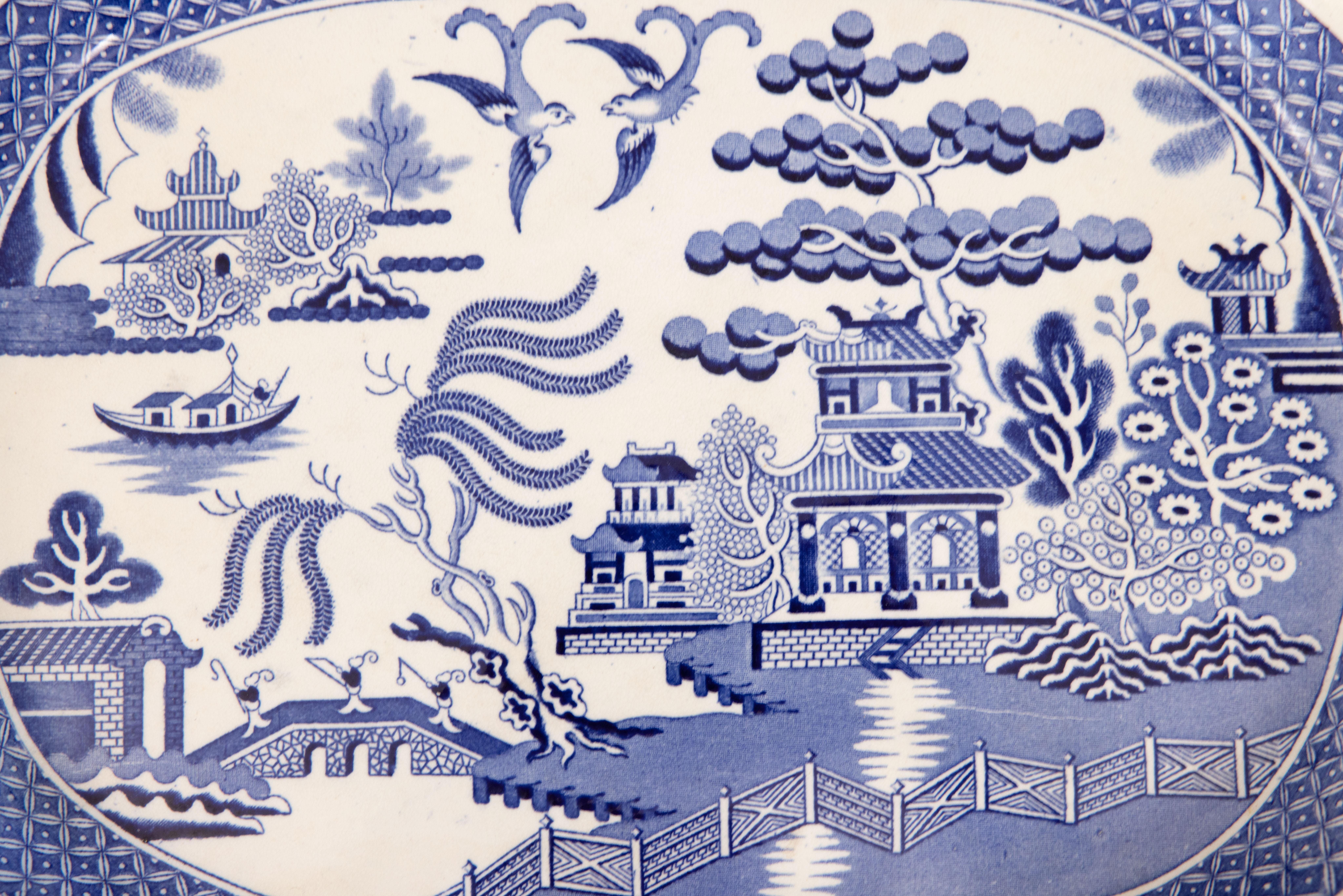 A superb 19th-century English Staffordshire transferware platter in the classic Blue Willow pattern. This lovely platter is a nice large size and heavy weighing over 5 lbs. It would be beautiful added to a collection or for serving or display.