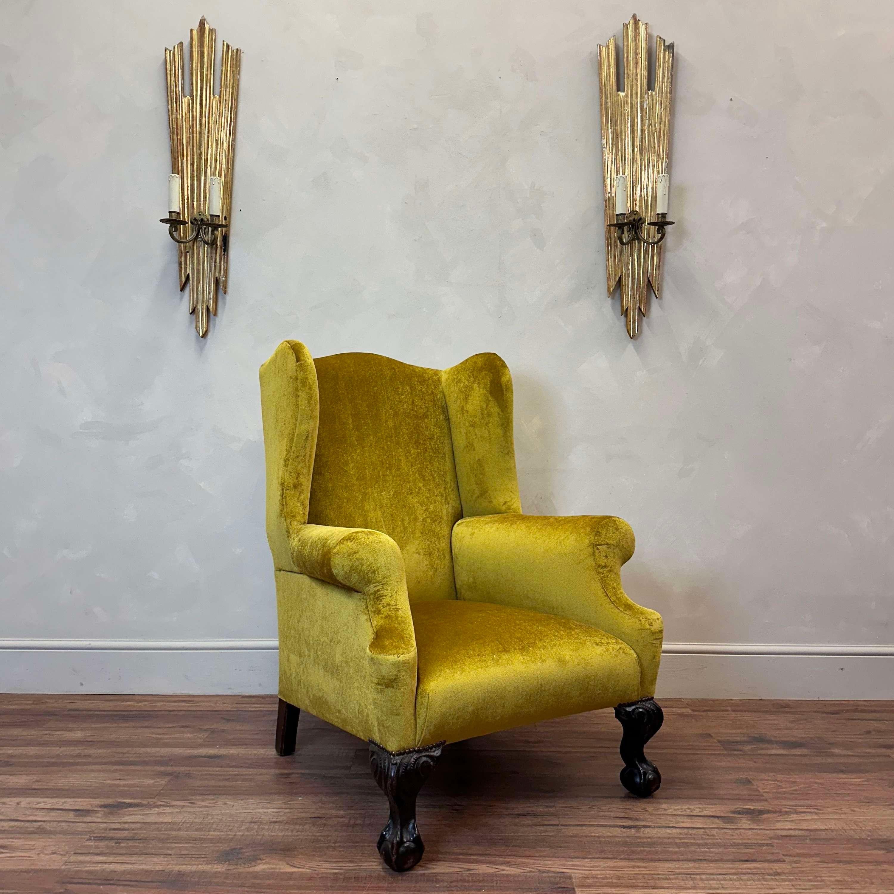 Newly upholstered in gold velvet, this quality made 19th century wingback sits on carved mahogany ball and claw feet. It is horsehair filled and resprung/webbed.

England, circa 1890.

Back height - 107 cm 
Wing  width - 64.5 cm
Depth - 90 cm 
Arm