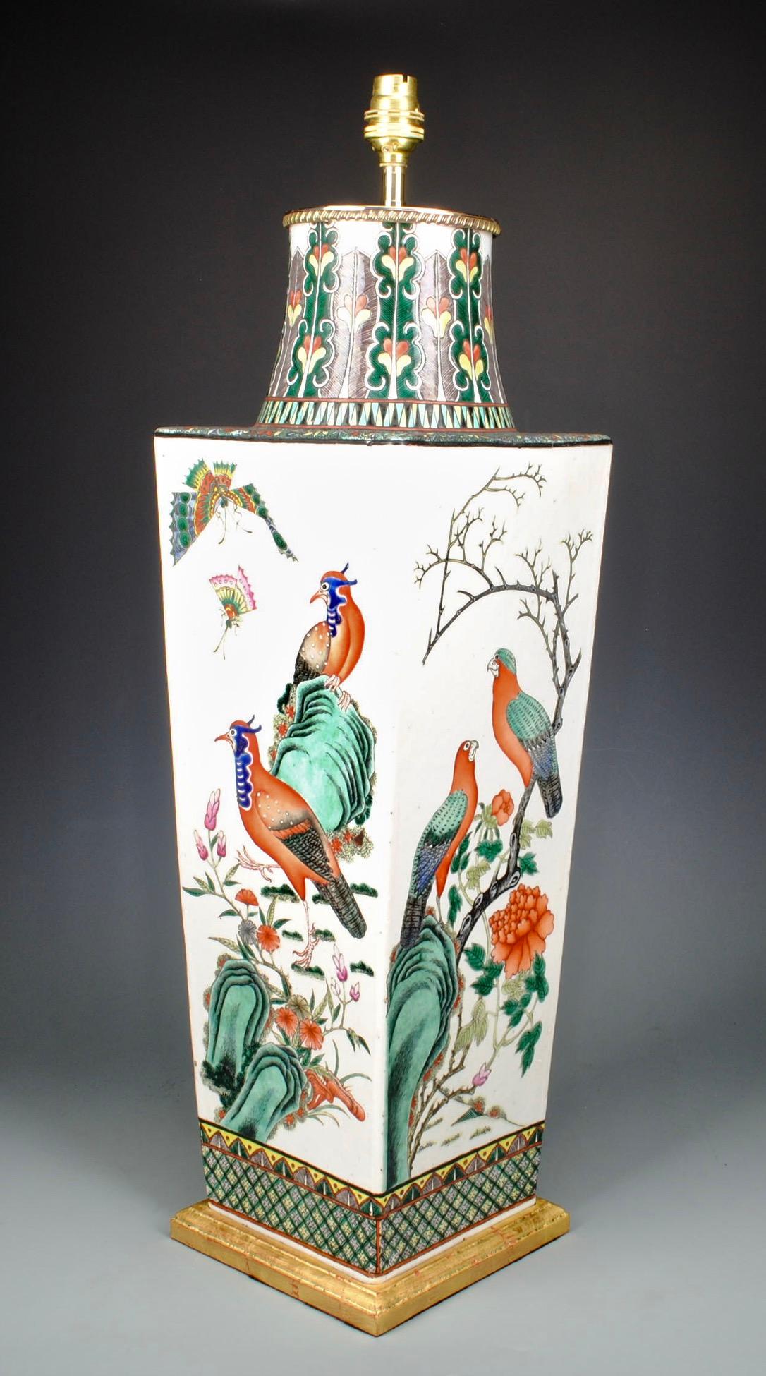 A fine 19th century Chinese famille verte tapered square vase, now mounted as a table lamp with gilt brass fittings. Beautifully decorated with brightly painted exotic birds and butterflies on a white ground.

Height of vase: 22.5 in (57 cm)