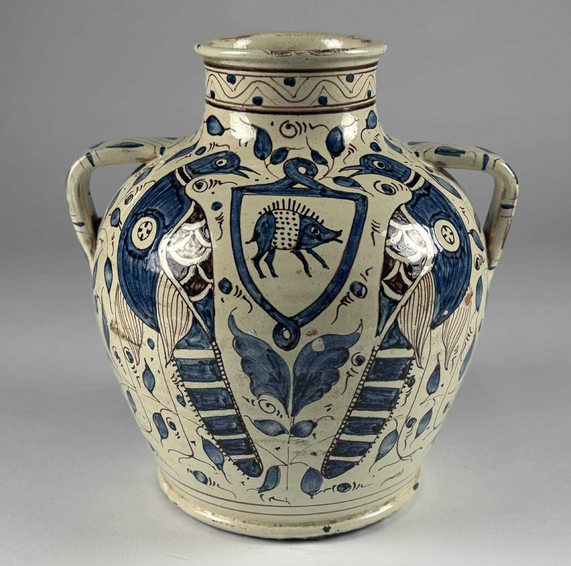 Large Firenze Armorial Drug Storage Jar. Most likely by Cantagalli Maiolica and Ceramic Factory near Florence who created a type of Renaissance Revival Maiolica using traditional production methods of tin glazing earthenware. This is Cantagalli