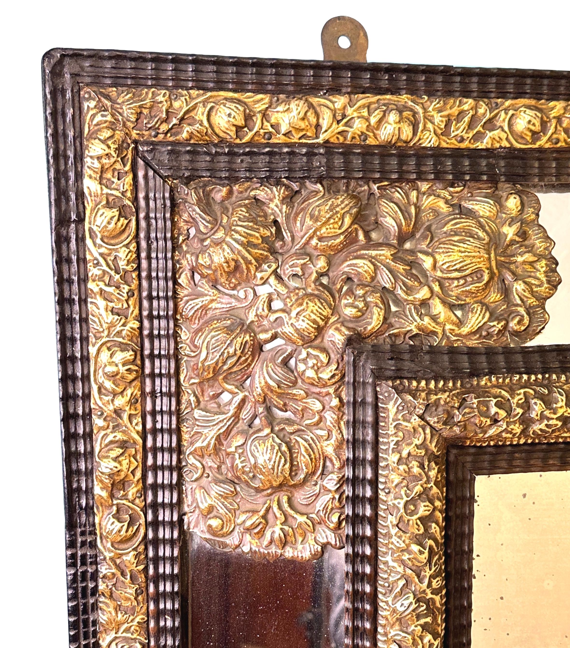 An Exceptional Quality And Unusually Large Mid 19th Century Flemish Ebonised And Brass Repousse, Ripple Cushion, Marginal Mirror, Of Rectangular Form, Having Large Central Bevelled Mirror Plate Surrounded By Foliate Borders And Further Mirror