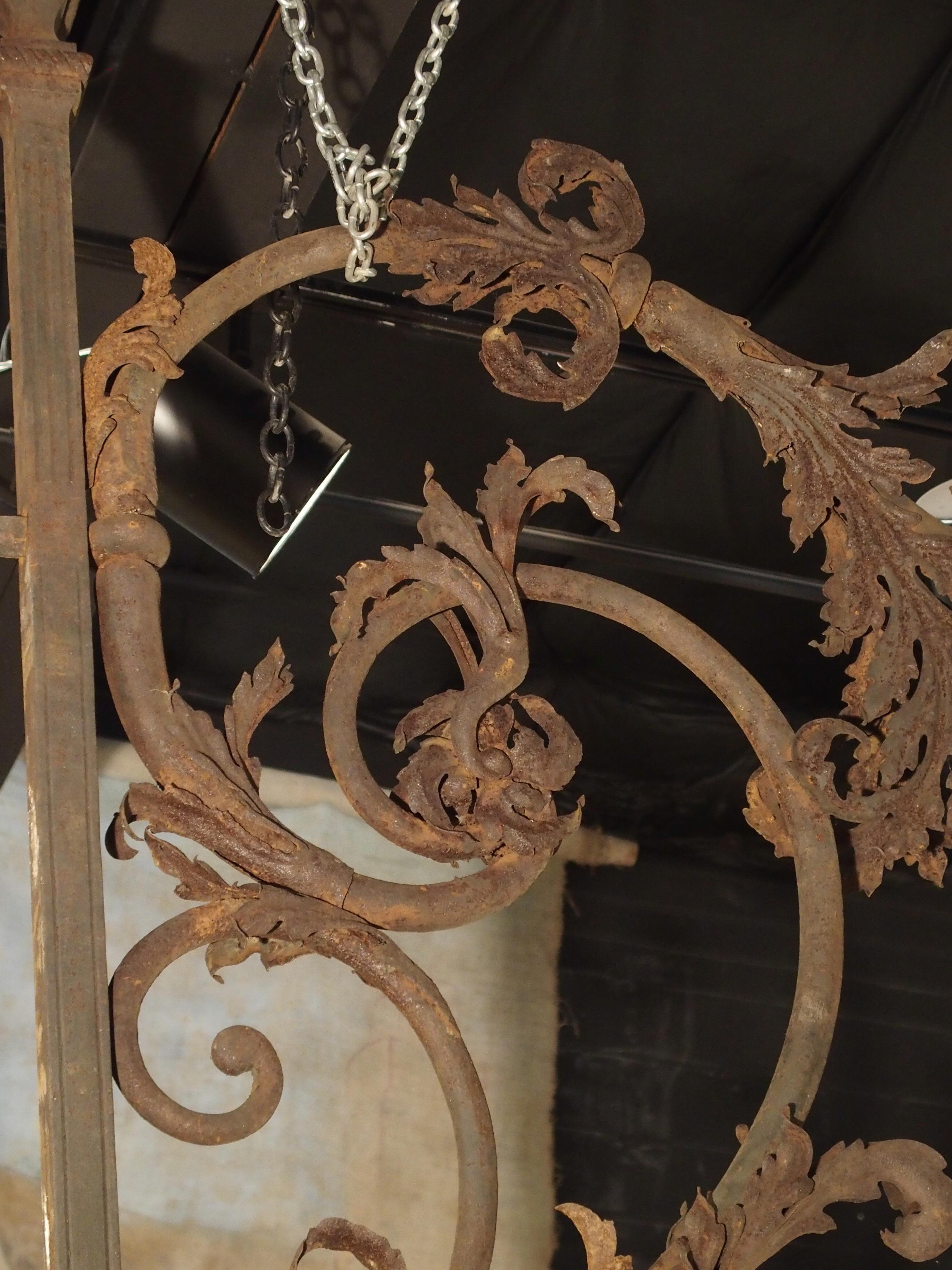 From the 1800’s, this very tall forged iron lantern holder is from the city of Poitiers, France.  Its form is graceful and flowing with C-and S-Scroll iron rods adorned with an abundance of acanthus leaves.  The Grand'Goule is the name of the large