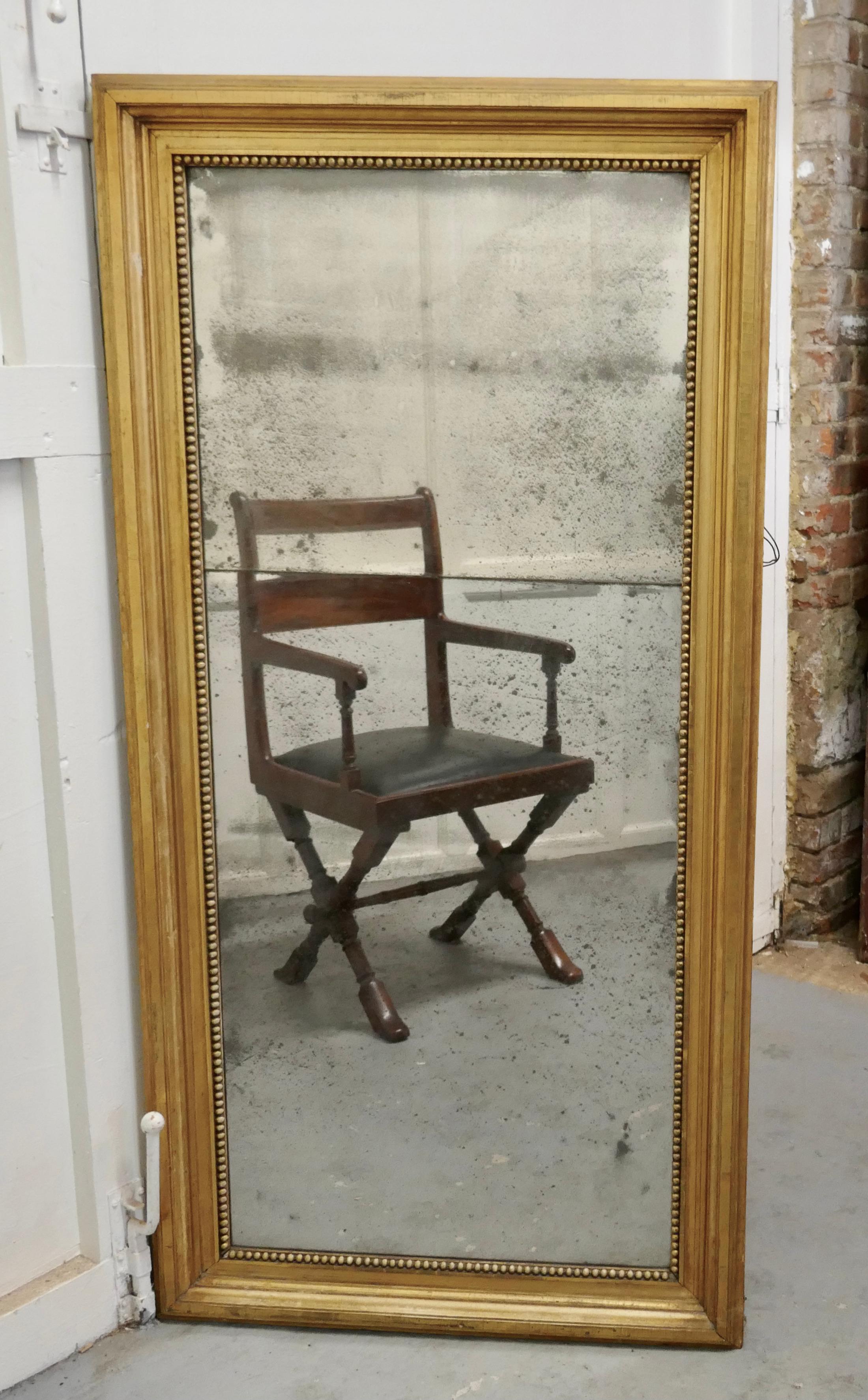 Large 19th century framed distressed wall mirror.

A lovely piece for the right person, this unusual mirror has an old 4” wide giltwood frame
The mercury glass mirror has an age related sparkle and a distressed look, the mirror is presented in 2