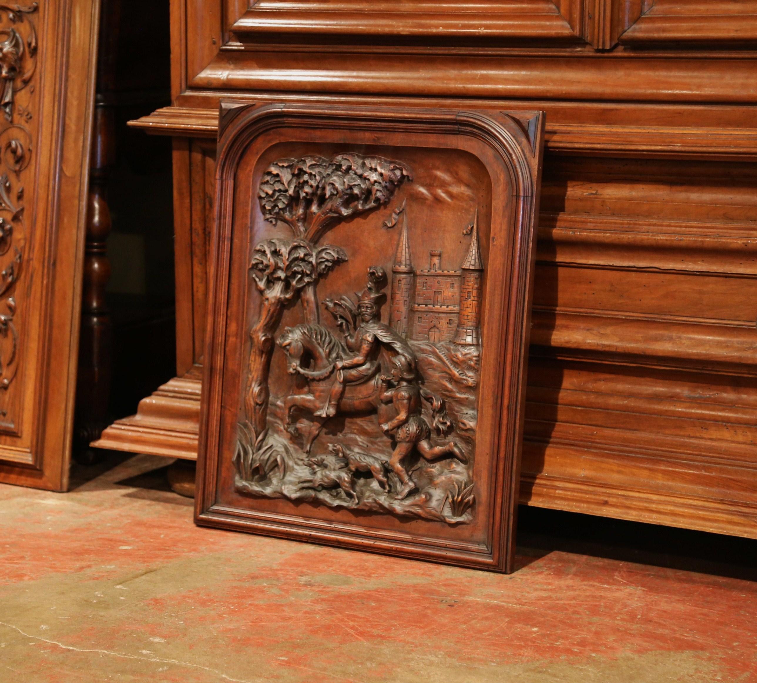 Decorate your office or game room with this elegant fruitwood wall panel; created in Southern France, circa 1870, the antique framed Renaissance piece features exquisite carvings in high relief including a soldier on his horse, two dogs and a page
