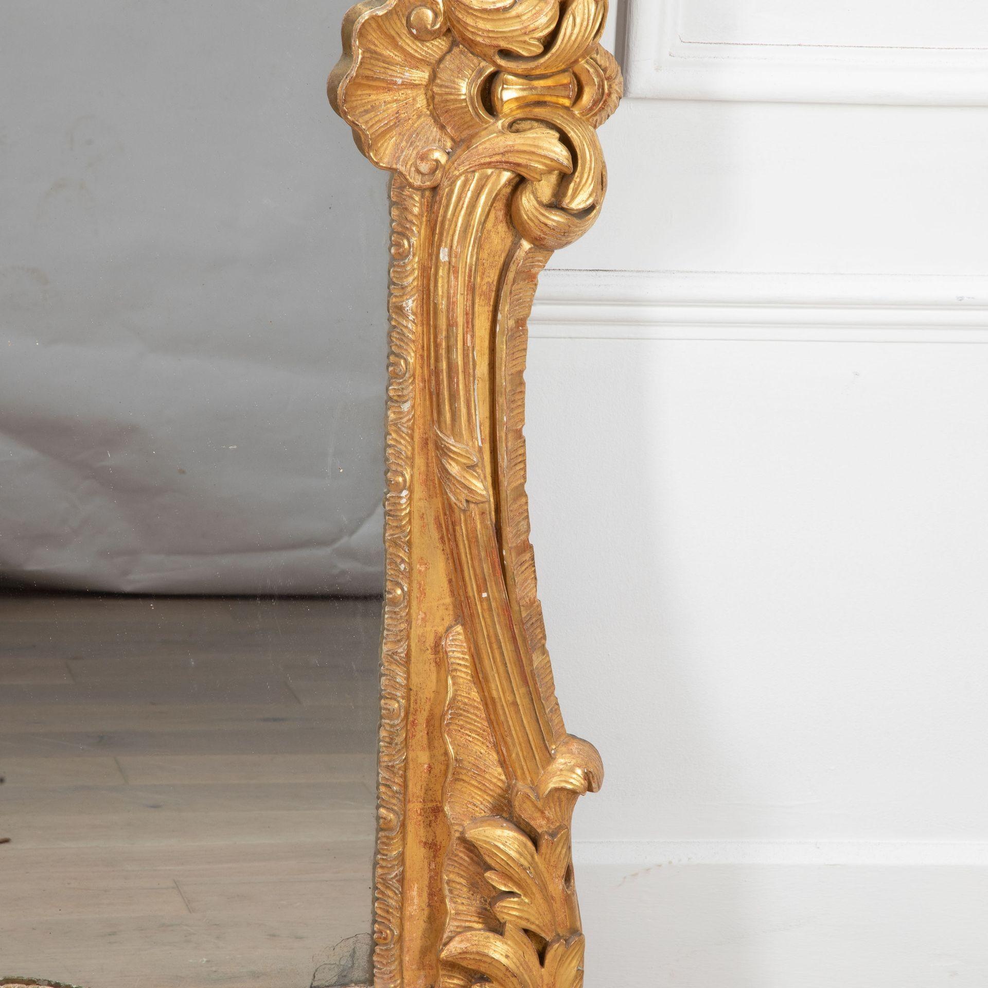 A large 19th Century French country house mirror in untouched condition.
With original mercury glass plate and deeply carved gilt wood frame.
Original boarded back. Circa 1850.