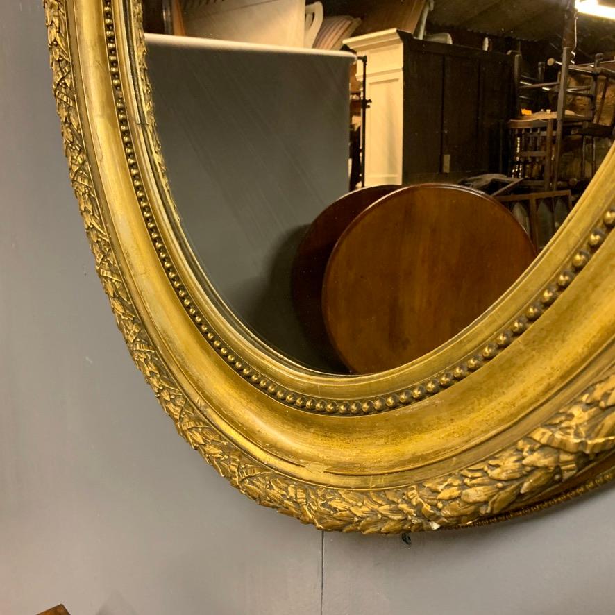 Late 19th Century Large 19th Century French Gilt Oval Mirror with Original Bevelled Mirror Plate